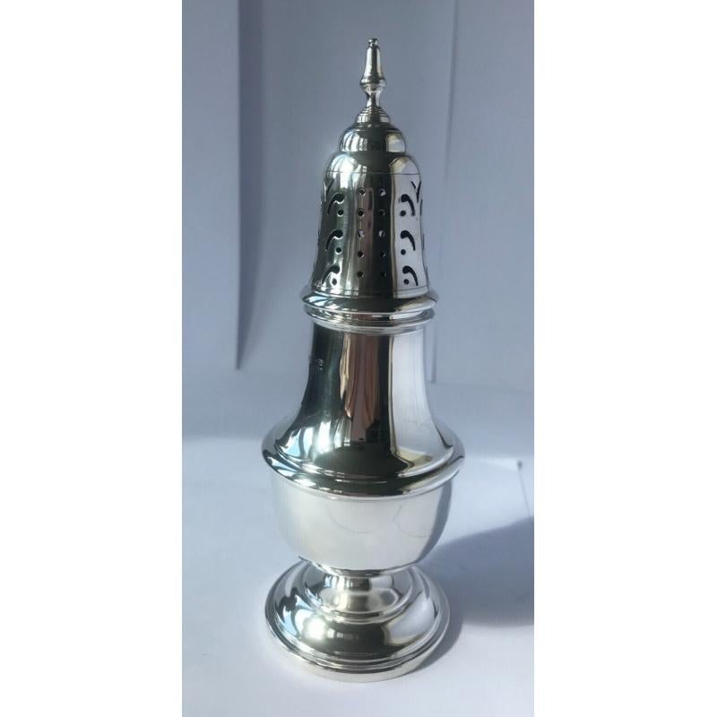In good vintage condition, this is a beautiful piece. It has a lovely rounded form, a pedestal foot and a finial on top.

Hallmarked: Made by Barker Ellis Silver Co in Birmingham in 1964.

The company was formed by a merger between Ellis Brothers