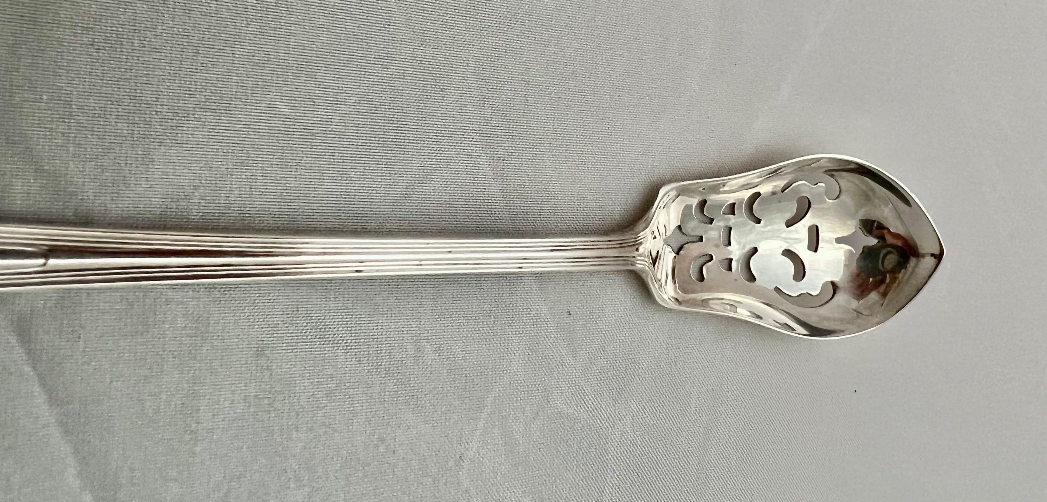 Sterling silver sugar spoon with a long graceful handle. The piece has a hallmark and is stamped Sterling. Probably English.
   