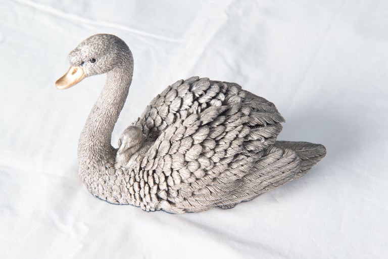 This silver filled swan is handmade of hallmarked filled silver in Sheffield, England, with fine workmanship that can be seen detailing in the meticulous detailing of every single feather. Hallmarked 925. Gold plated beak. Handmade in England.
