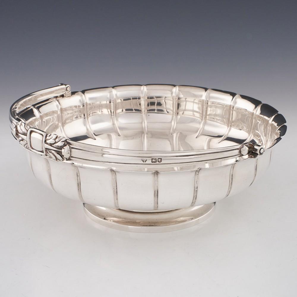 Fruit or bread basket to be used and appreciated

Heading : Sterling silver swing handled pedestal bowl
Date : Hallmarked in London in 1908 for Holland, Aldwickle & Slater
Period : Edward VII
Origin : London England
Decoration : Gadrooned body,
