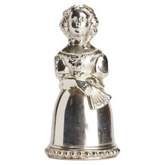 Sterling silver table bell, a woman with a fan, USA end of 19th century.