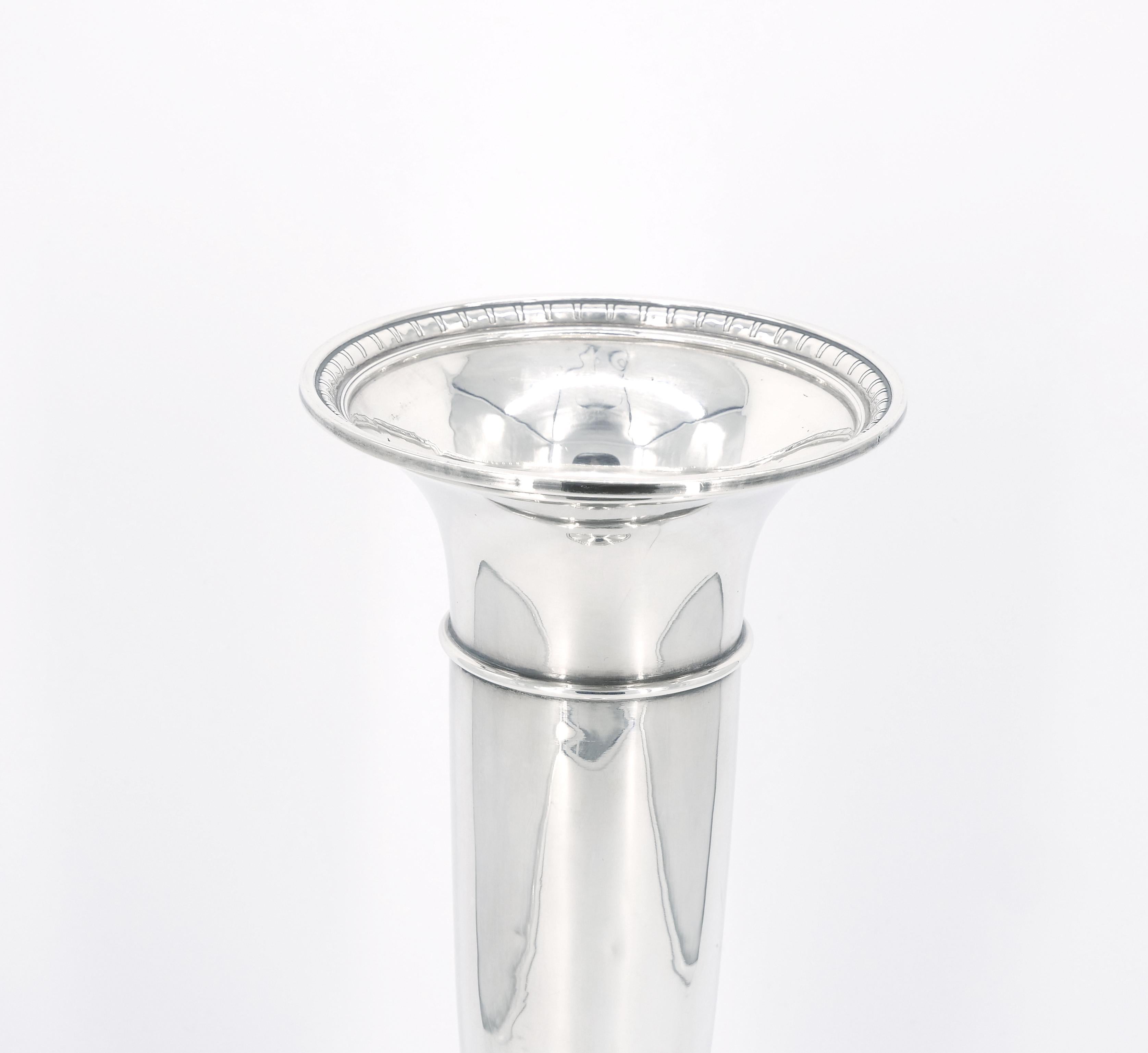 
immerse your living space in the enchanting beauty of this exquisite sterling silver trumpet-shape decorative vase. This captivating piece showcase a meticulously engraved floral design that radiates elegance and sophistication. Crafted from