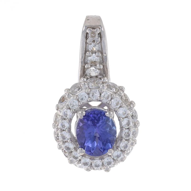 Metal Content: Sterling Silver

Stone Information
Natural Tanzanite
Treatment: Routinely Enhanced
Color: Purple

Natural White Topaz

Style: Halo

Measurements
Tall (from stationary bail): 25/32