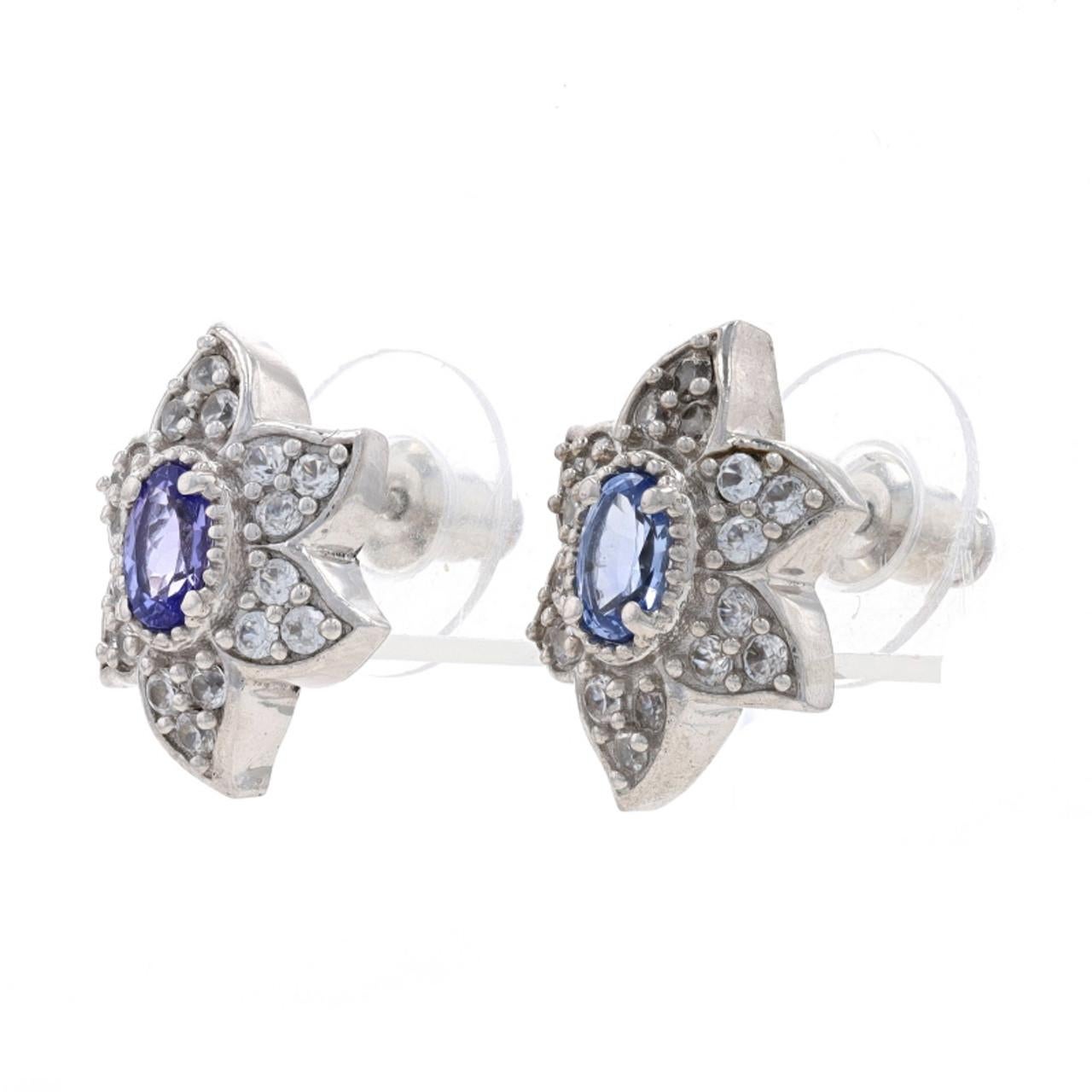 Sterling Silver Tanzanite & White Topaz Large Stud Earrings 925 Flowers Pierced

Stone Information:
Natural Tanzanites
Treatment: Routinely Enhanced
Color: Purple

Natural White Topaz

Additional information:
Material: Metal Sterling Silver
Style: