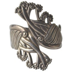 Sterling silver TAXCO Bernice Goodspeed repousse clamper/bypass bracelet Vintage
