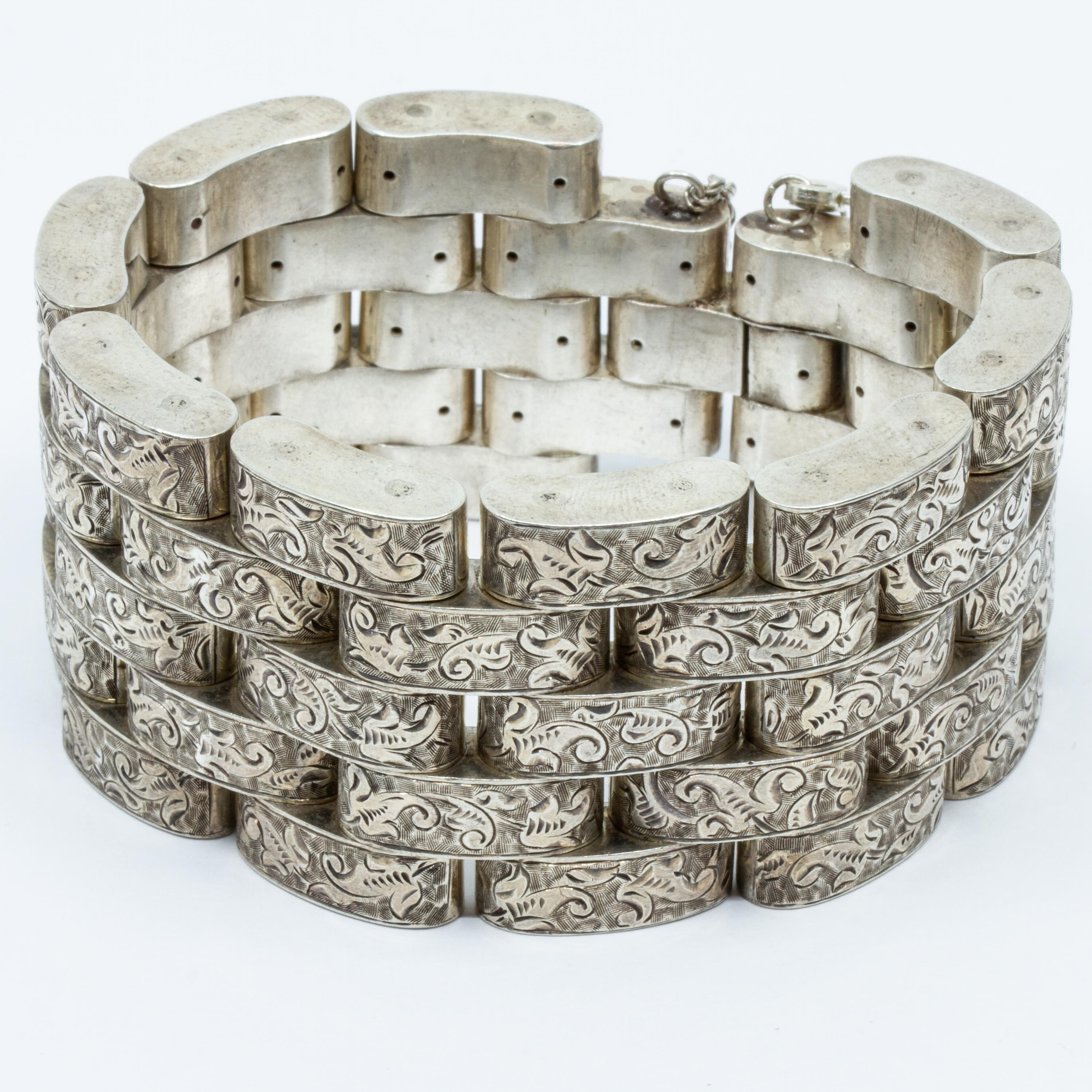 Offered is a Circa 1940 Sterling silver Taxco Mexico wide hinged bracelet. 
The people who lived in the area now known as Taxco were using silver long before the Spanish arrived in the Americas. They mined silver and used it to make gifts for Aztec