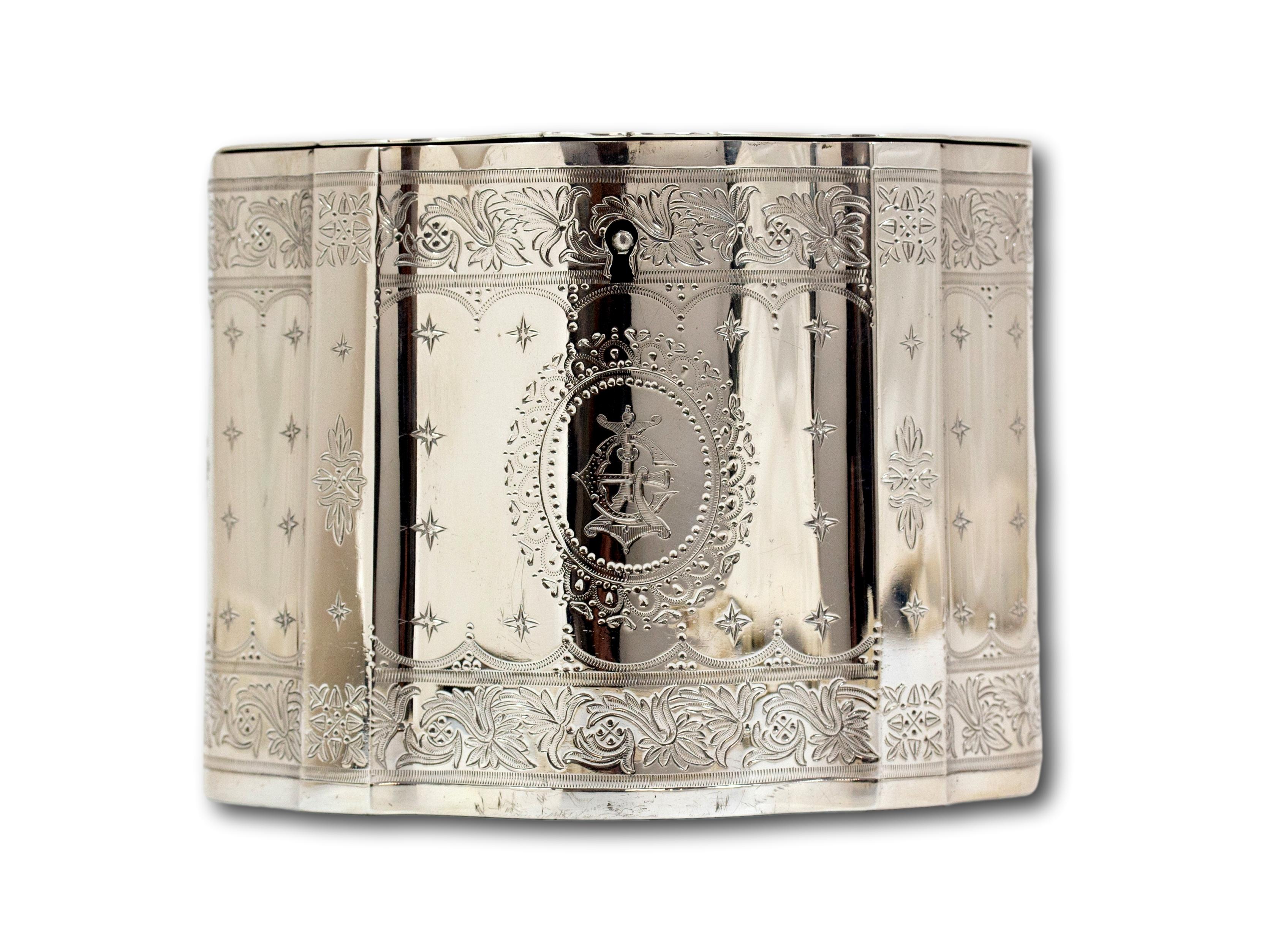 From our Tea Caddy collection, we are pleased to offer this solid silver tea caddy by Elkington & Company. The Tea Caddy of unusual serpentine form with shaped sides extensively decorated with a central band of chased stars around an oval cartouch