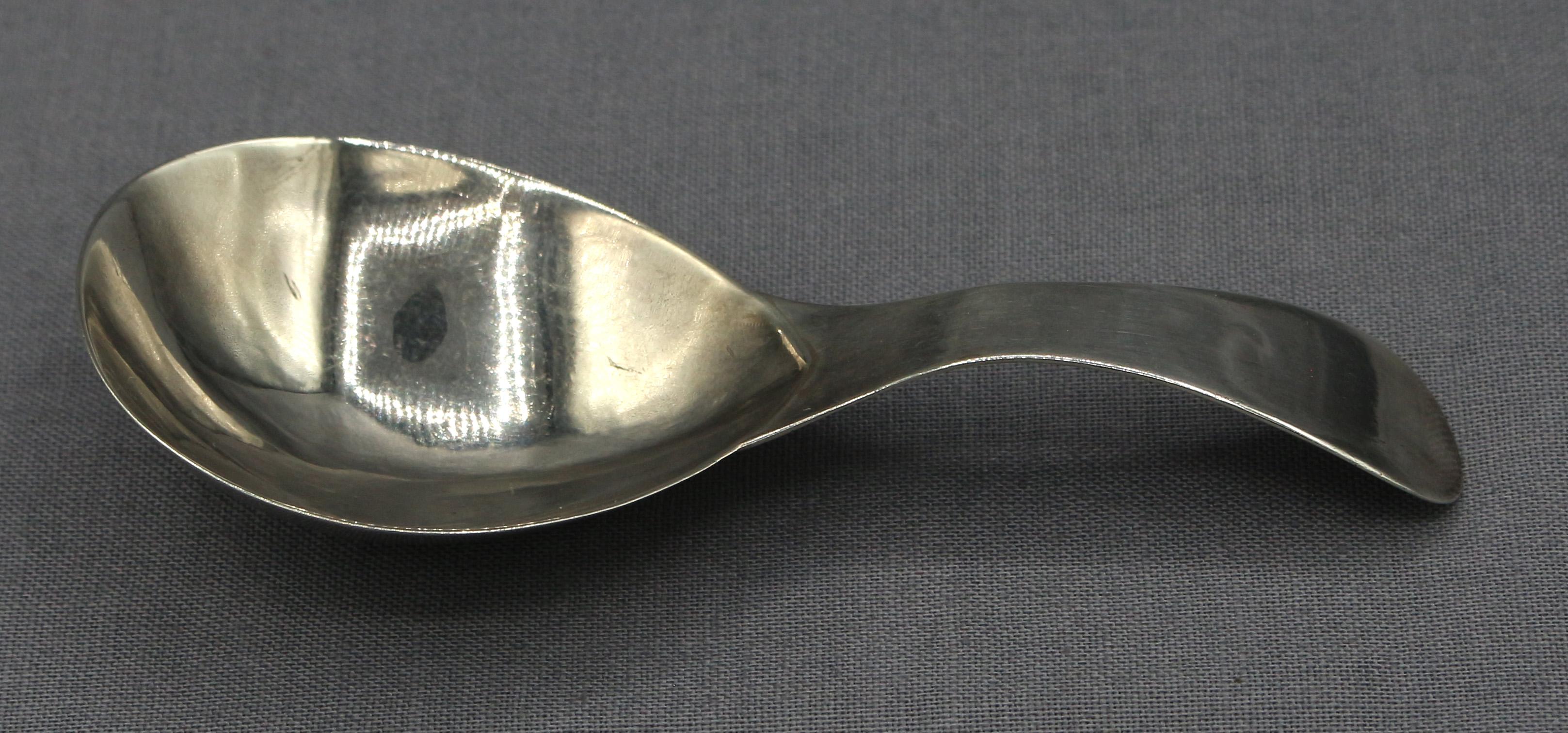 Sterling silver tea caddy spoon by Hester Bateman, London, 1790. Old English pattern. While several elaborate models were in her offerings, this simple example best typifies her clientele of more modest means. 0.30 troy oz.
3.5