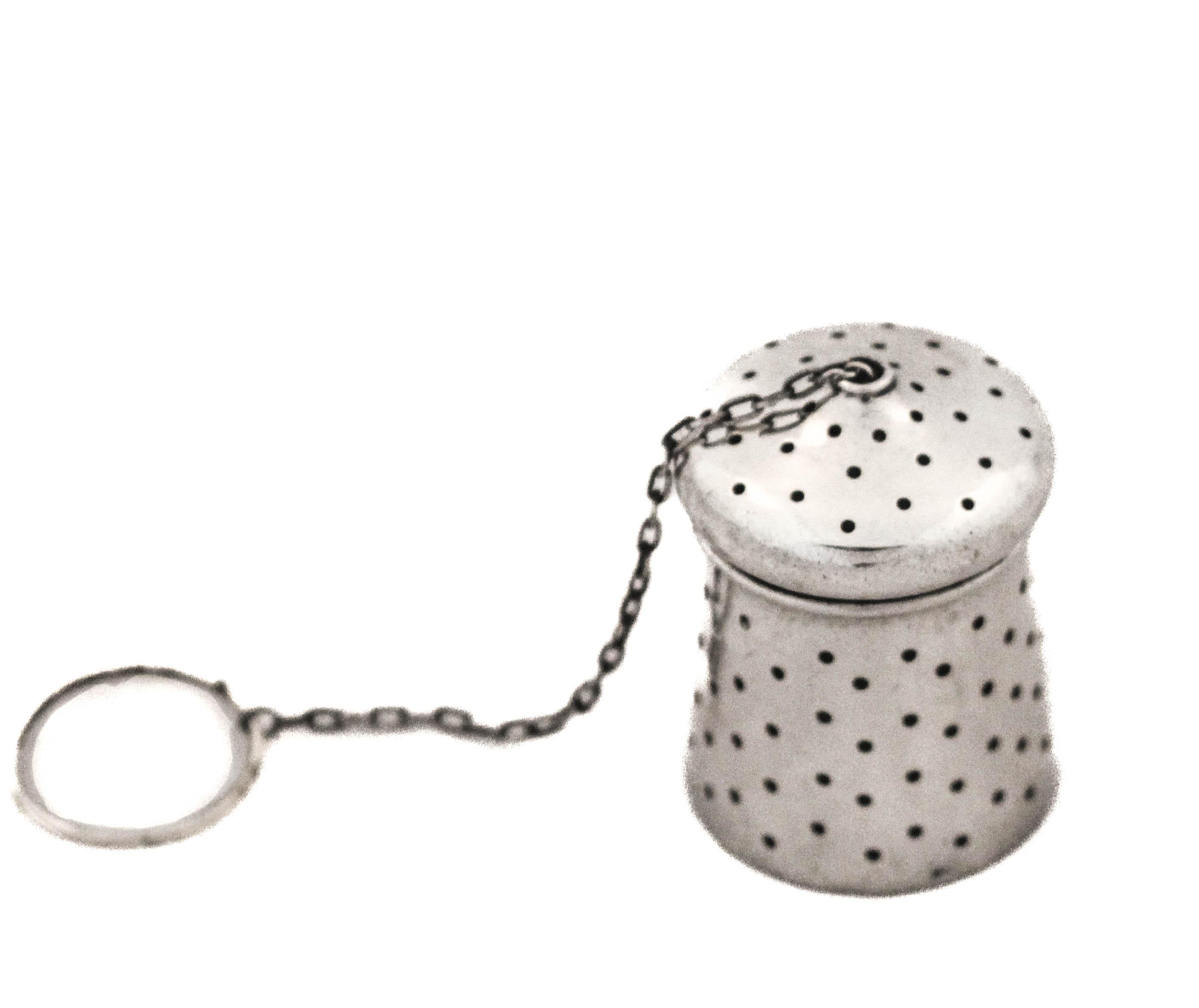 Being offered is a sterling silver tea leaf infuser made by the Alvin Silver Company.  It has holes all around the body plus the lid so it evenly distributed.  A fresh cup of hot tea goes a long way during the cold winter days and nights.