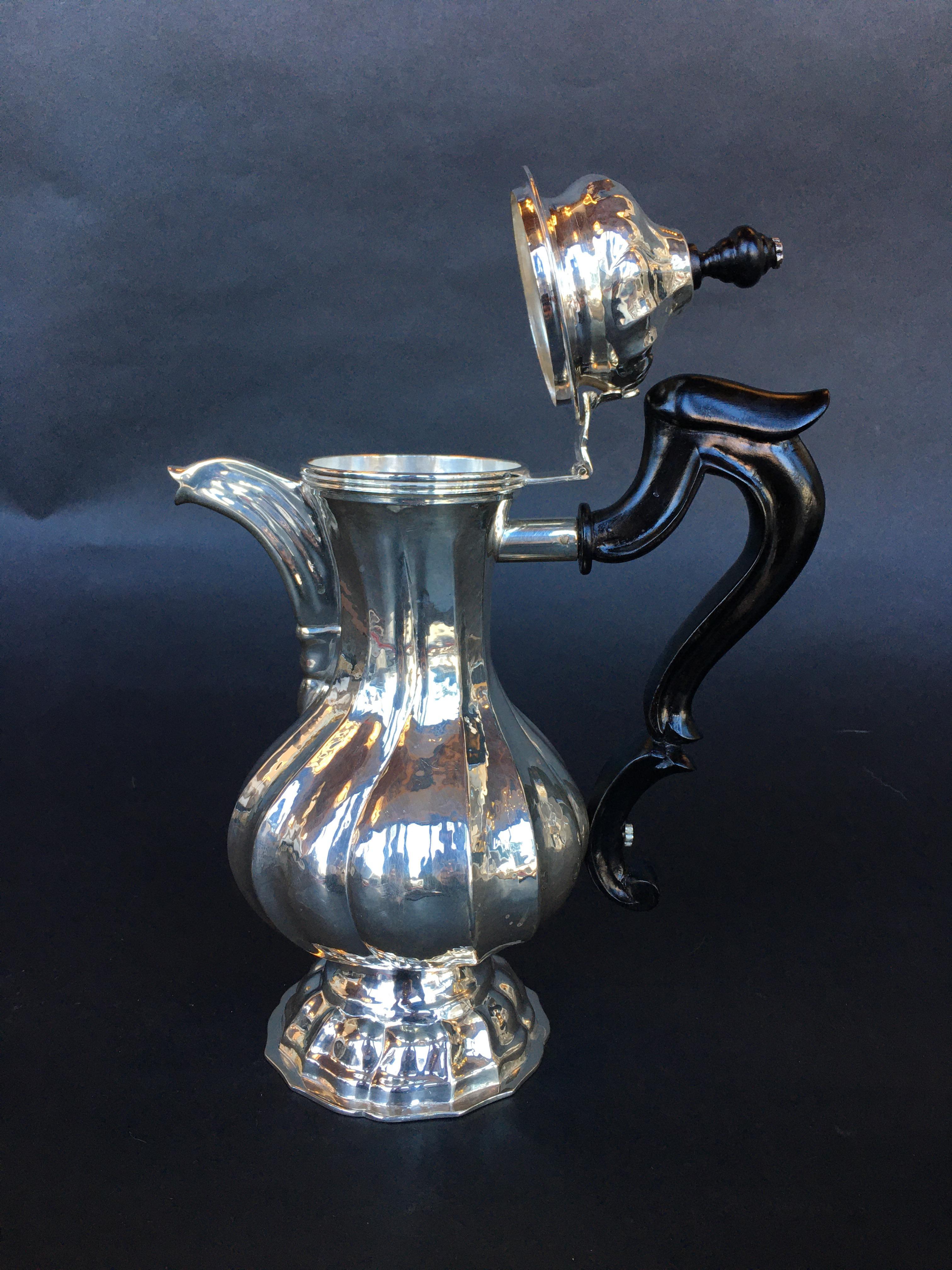 Sterling silver tea pot.