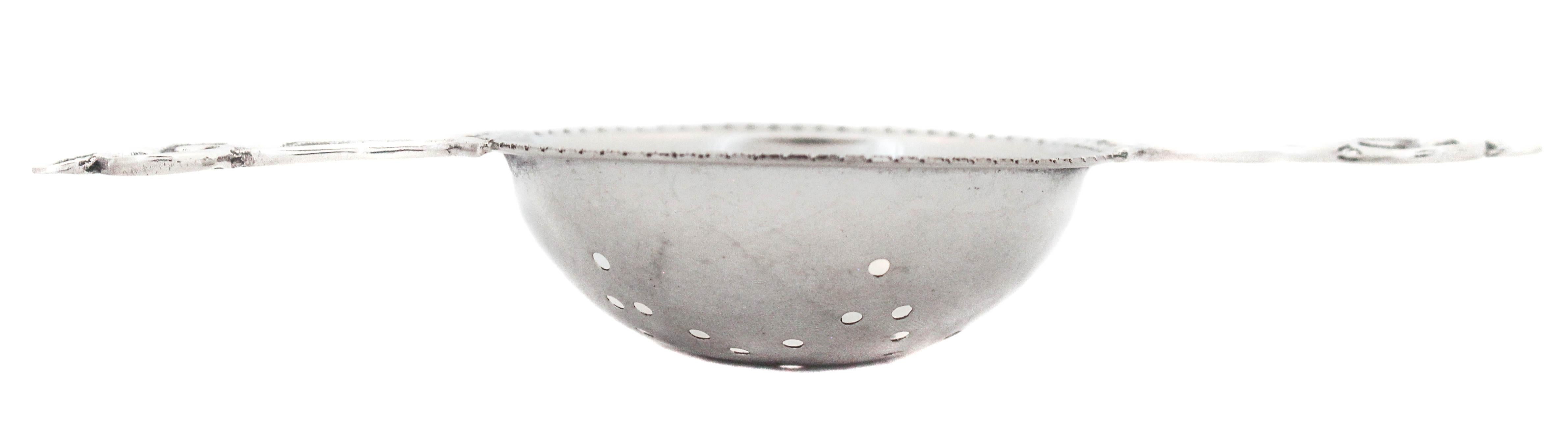 A sterling silver tea strainer is the perfect gift for any tea drinker. It is practical and yet beautiful. A pierced bowl with two handles to rest on a mug.
