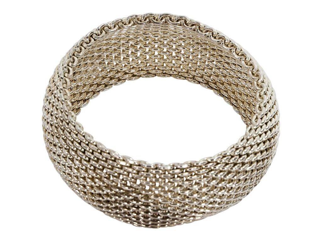 Product details:  Sterling silver wide Somerset bangle by Tiffany & Co.  Mesh design.  Slip-on style.  7