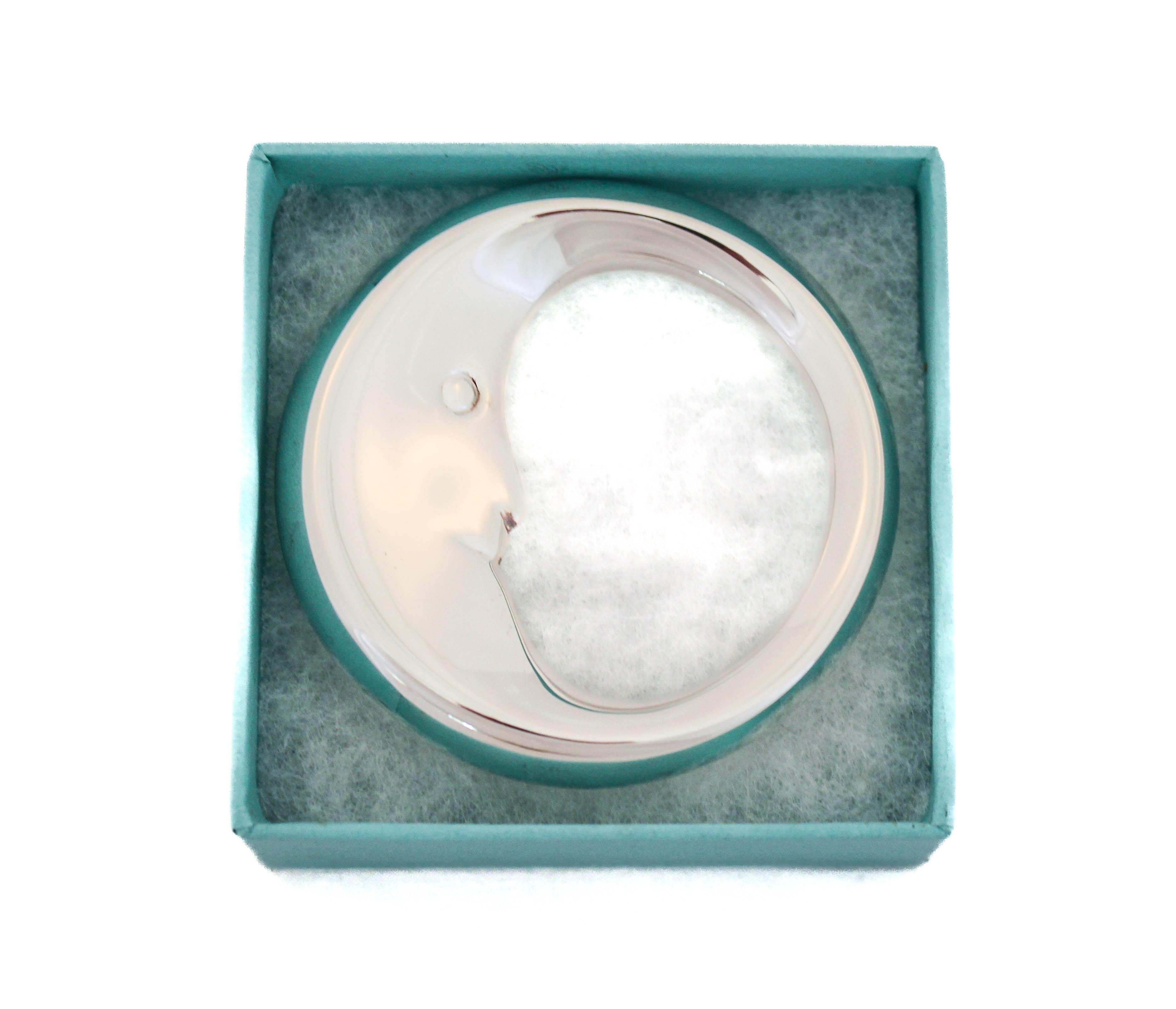 Being offered is a sterling silver baby rattle by the world renowned Tiffany and CO.  The rattle is circular and designed in the shape of the moon. For those nights when the baby is in its crib and you want them to have sweet dreams.  A beautiful