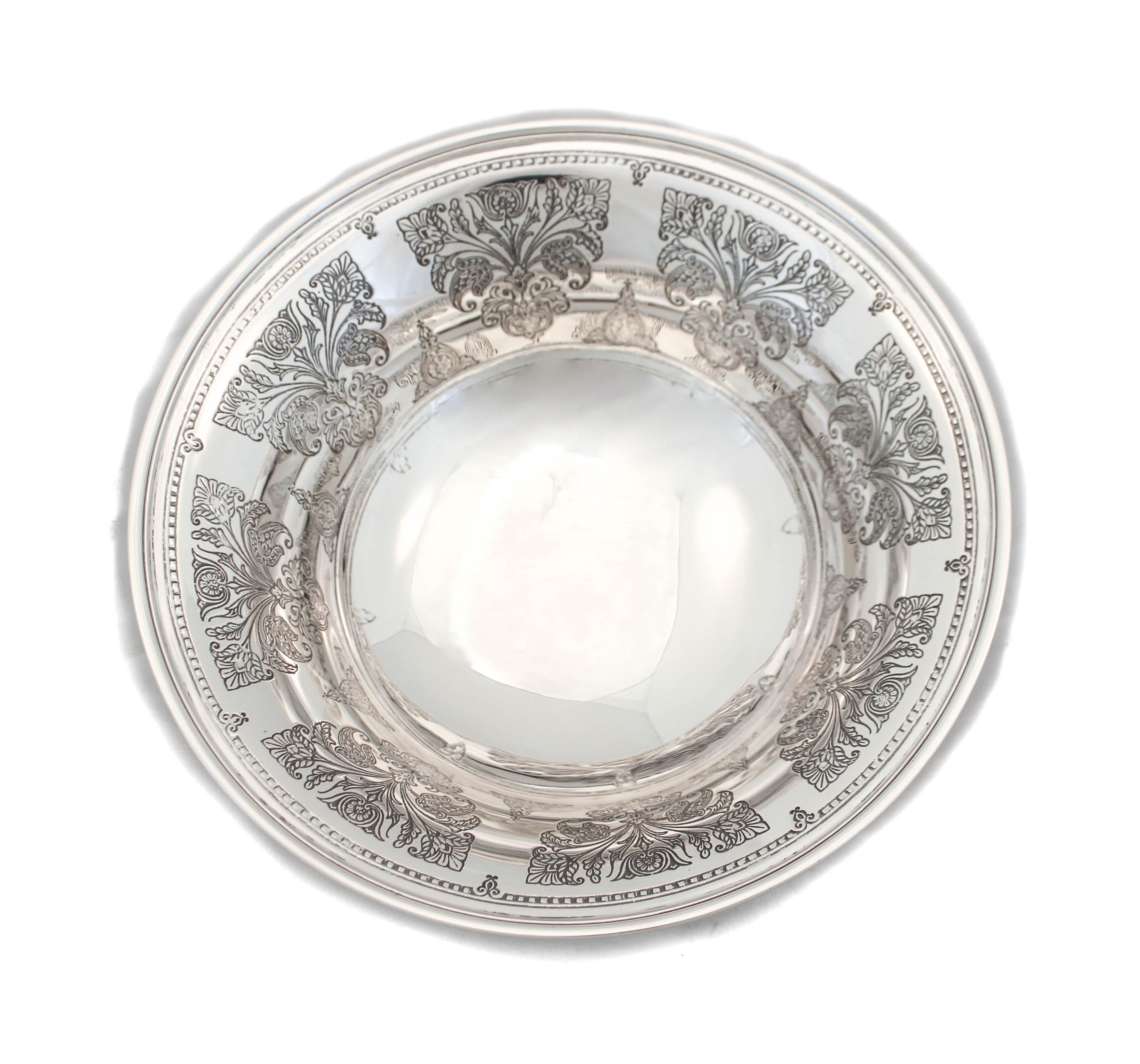 Being offered is a sterling silver bowl by Tiffany & Company. The workmanship is beautiful and the etched design is pristine. Each leaf and curve are crisp and have not faded over time. The bowl stands on a non-weighted pedestal. The shape curves