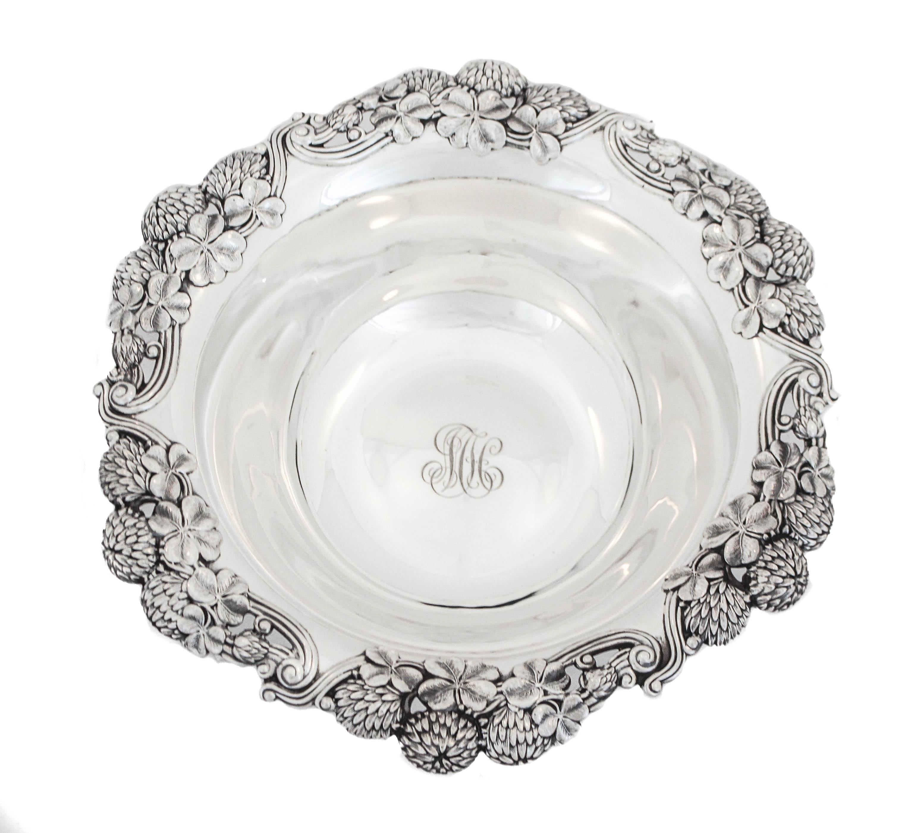 We are thrilled to offer you this sterling silver bowl made by the renowned Tiffany and Company. The bowl has a scalloped rim decorated with Chrysanthemums, clovers and pines. A rich mixture of natures bounties. In the center there is a hand