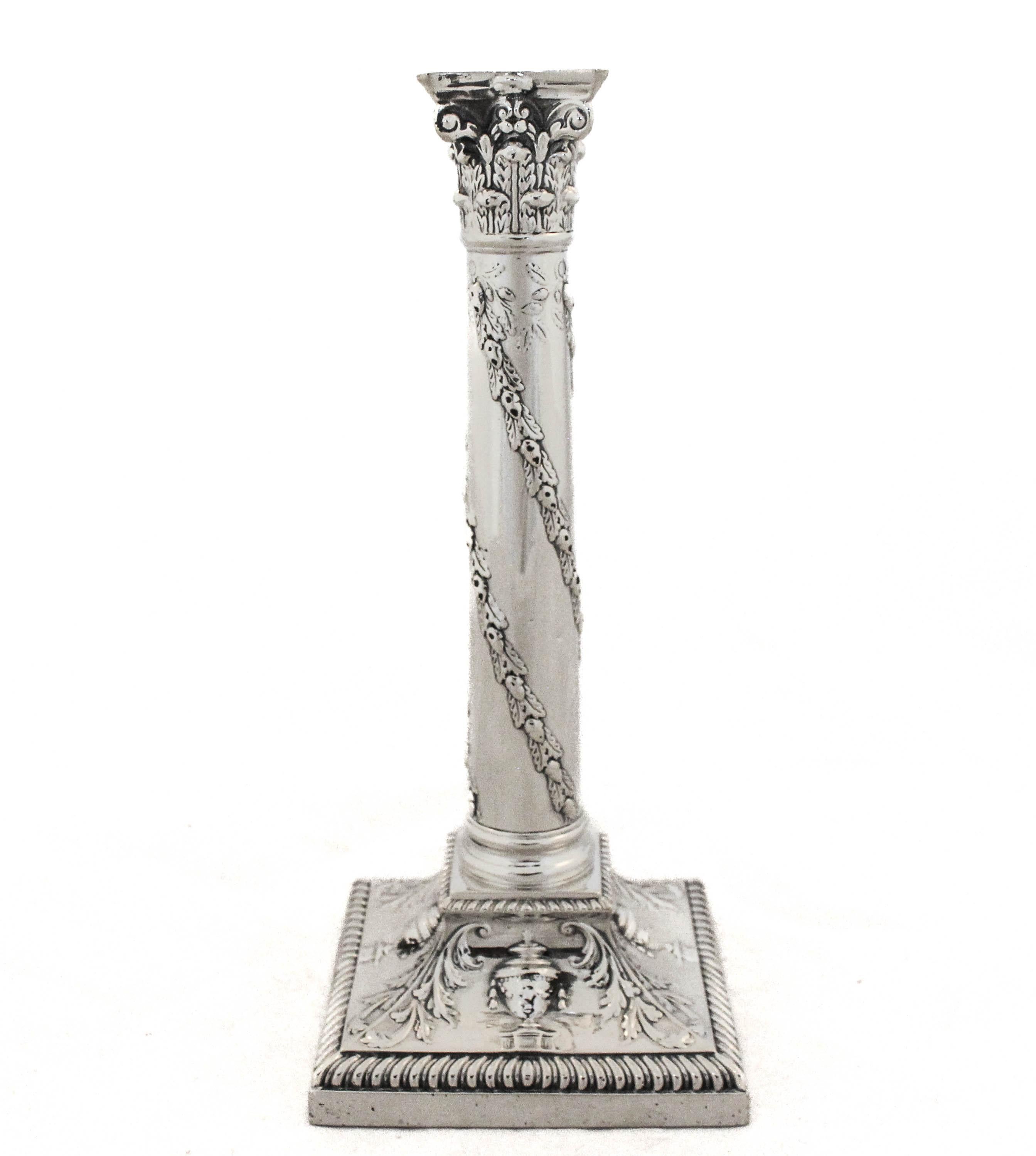 We are happy to offer this pair of sterling silver candlesticks.  Made in England for the world renowned Tiffany and Company in the late nineteenth century.  They have that distinctive square English base and column-shaped body that has become