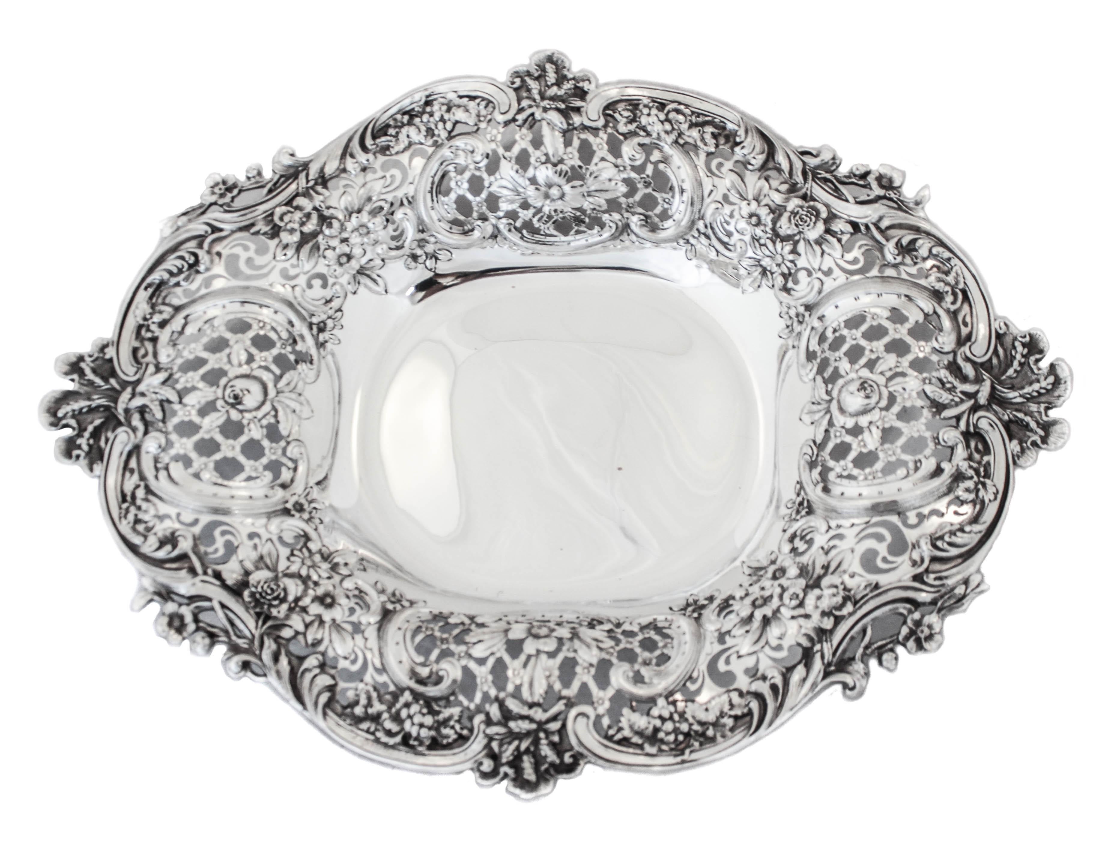 We are honored to offer you this sterling silver Tiffany centerpiece from the late nineteenth century.  Just an exquisite piece of sterling silver hollowware that only Tiffany & Company could design and manufacture.  Standing on four feet this