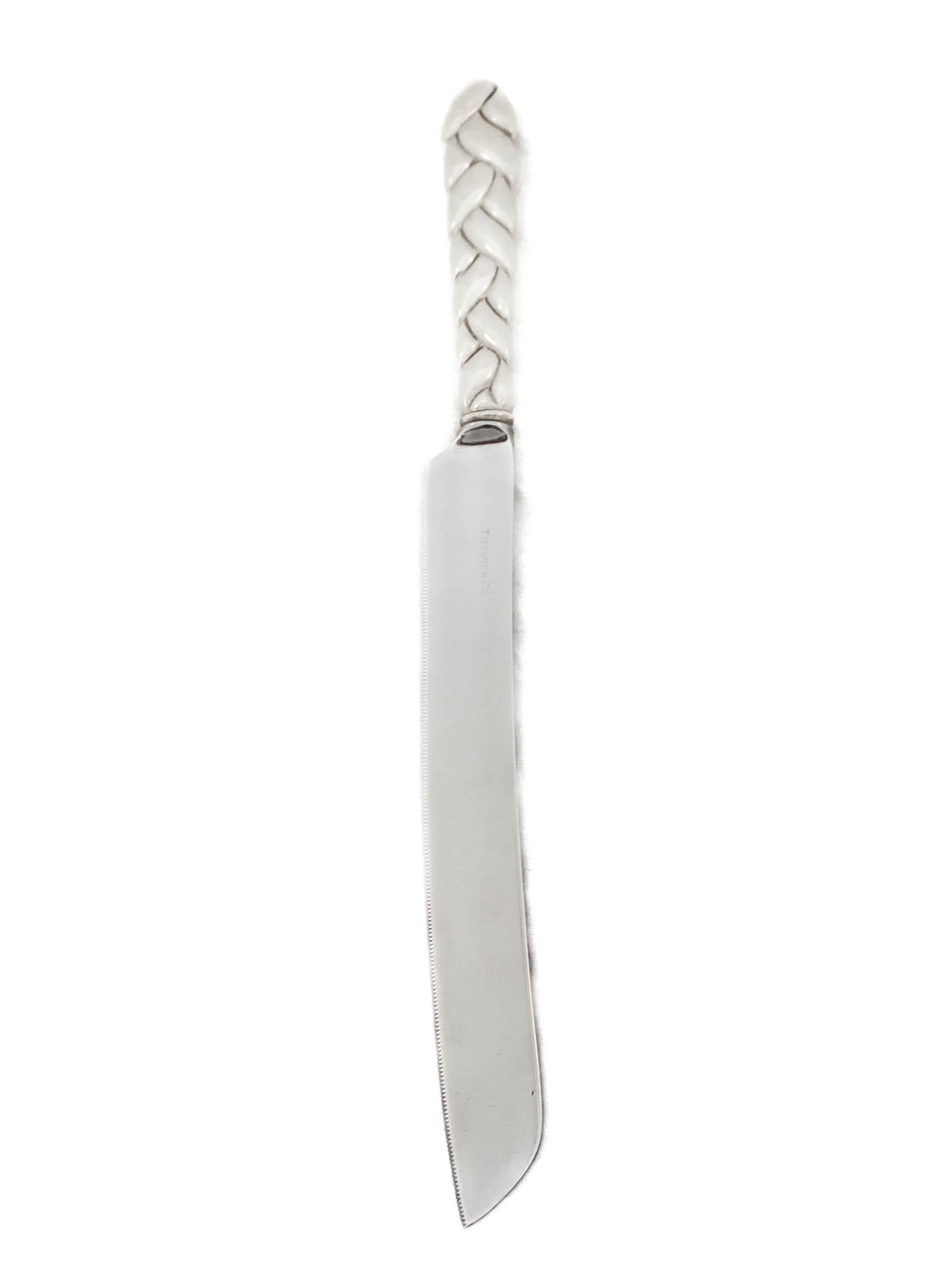 Being offered is a sterling silver challah (bread) knife by the world renowned Tiffany and Company.  The silver knife comes with the original sleeve and box.  The iconic robin’s-egg blue hue known around the world today as Tiffany blue has been
