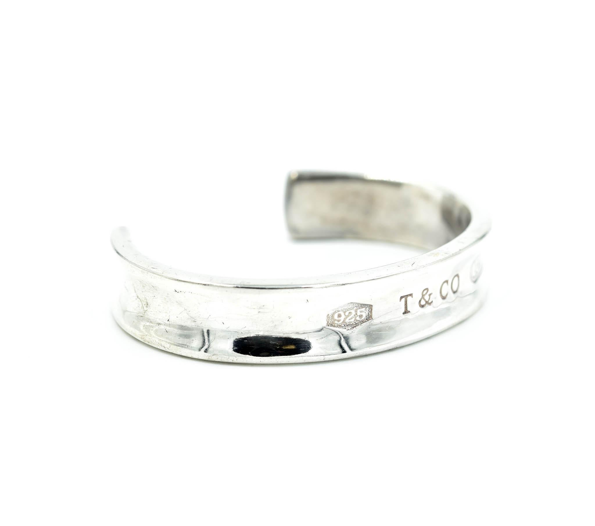 A classic design by Tiffany & Co! This is a sterling silver Tiffany & Co “1847” cuff bracelet. The bracelet is hallmarked “.925 T&CO 1837.” The bracelet will fit up to a 6 ½ inch wrist and measures 12mm wide. Total weight of the cuff bracelet is