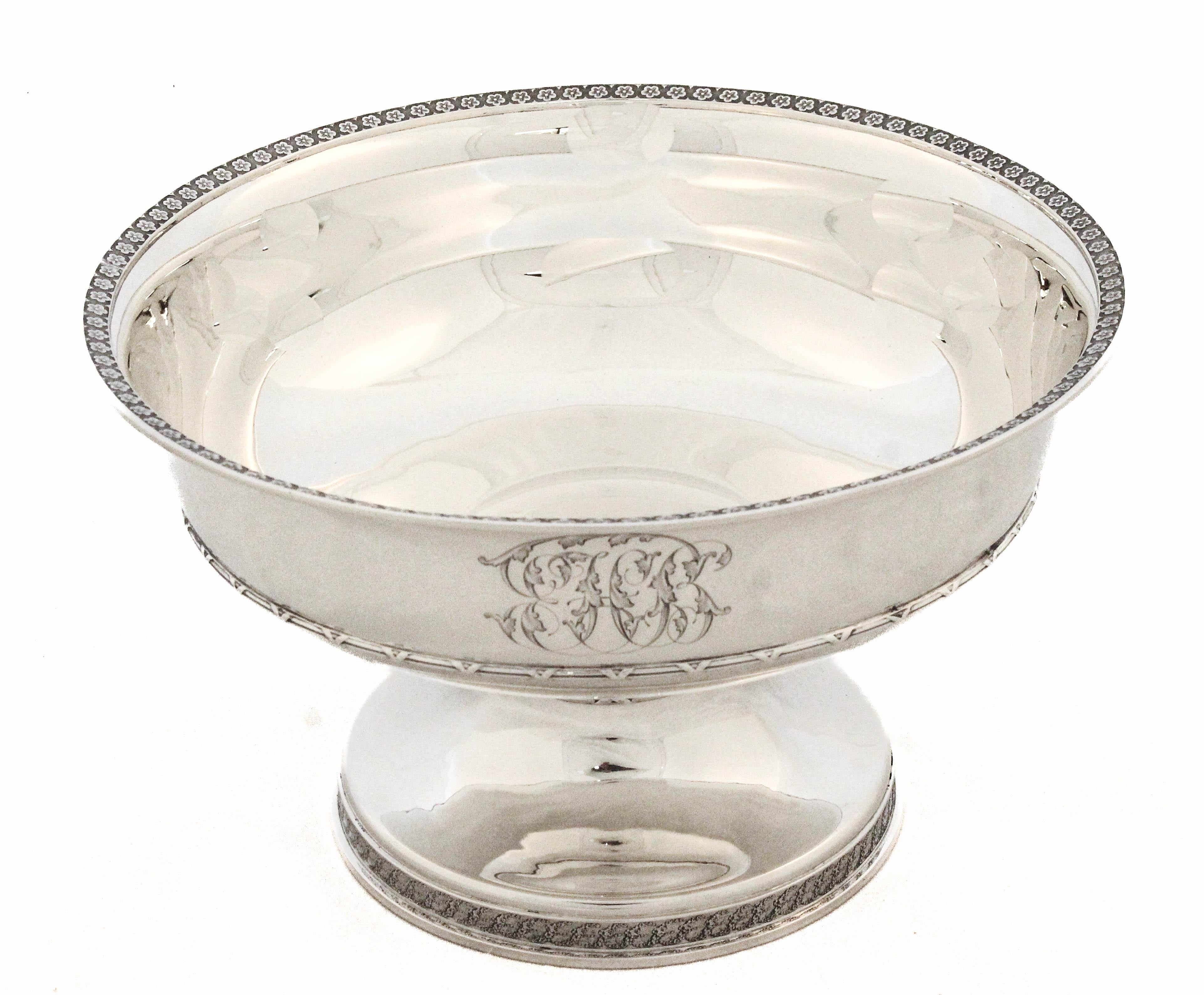 A refined and elegant sterling silver bowl by Tiffany & Company, elevated on a non-weighted pedestal and showcasing the brand’s signature balance of understated luxury and thoughtful detail. The bowl’s silhouette is graceful and fluid, with clean,