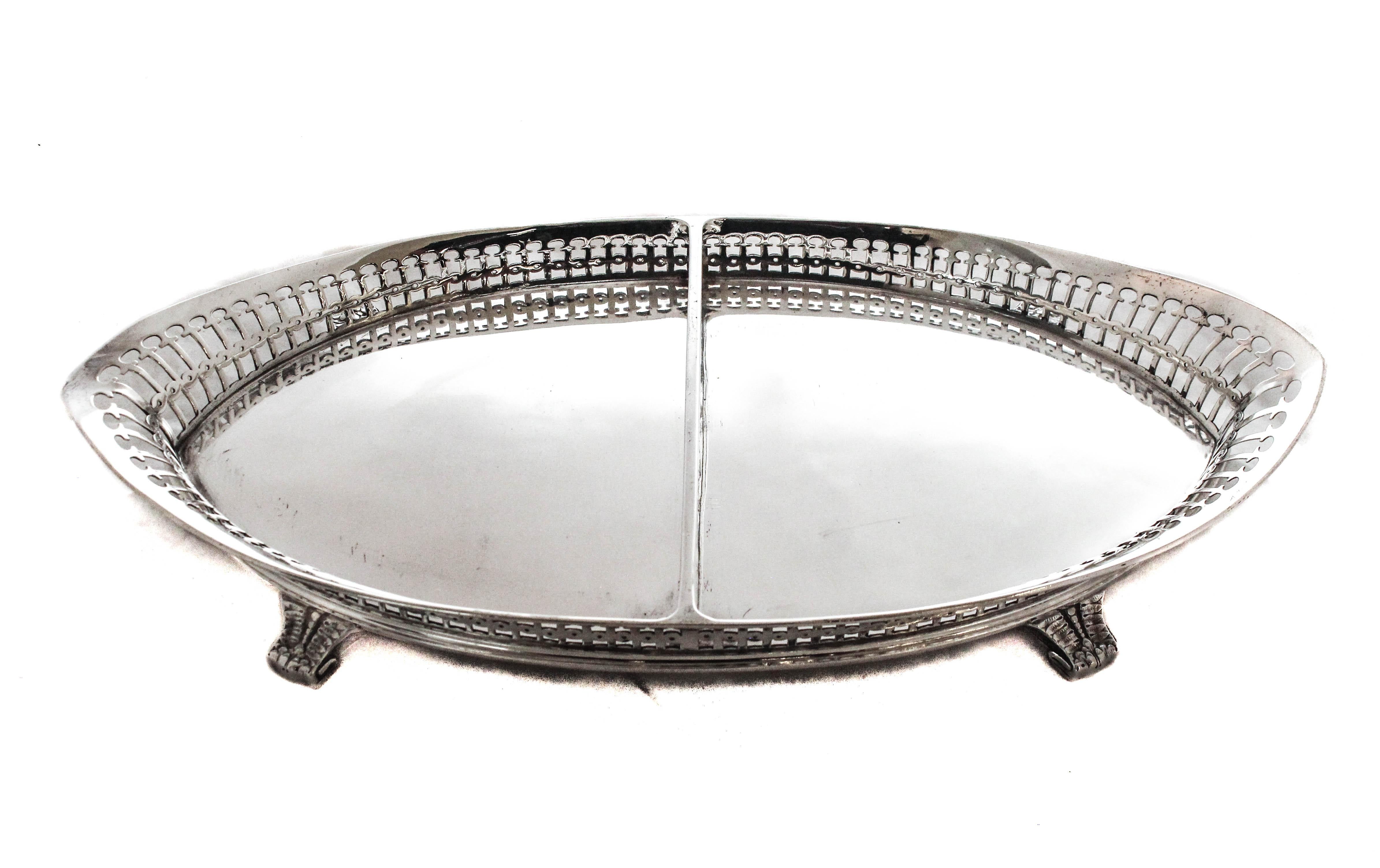 Being offered is a sterling silver sectional dish by the world renowned Tiffany & CO.  Dating to the 1880’s this piece is oval shaped with a reticulated rim and divider.  It stands on four feet that curve outwards complementing the reticulated