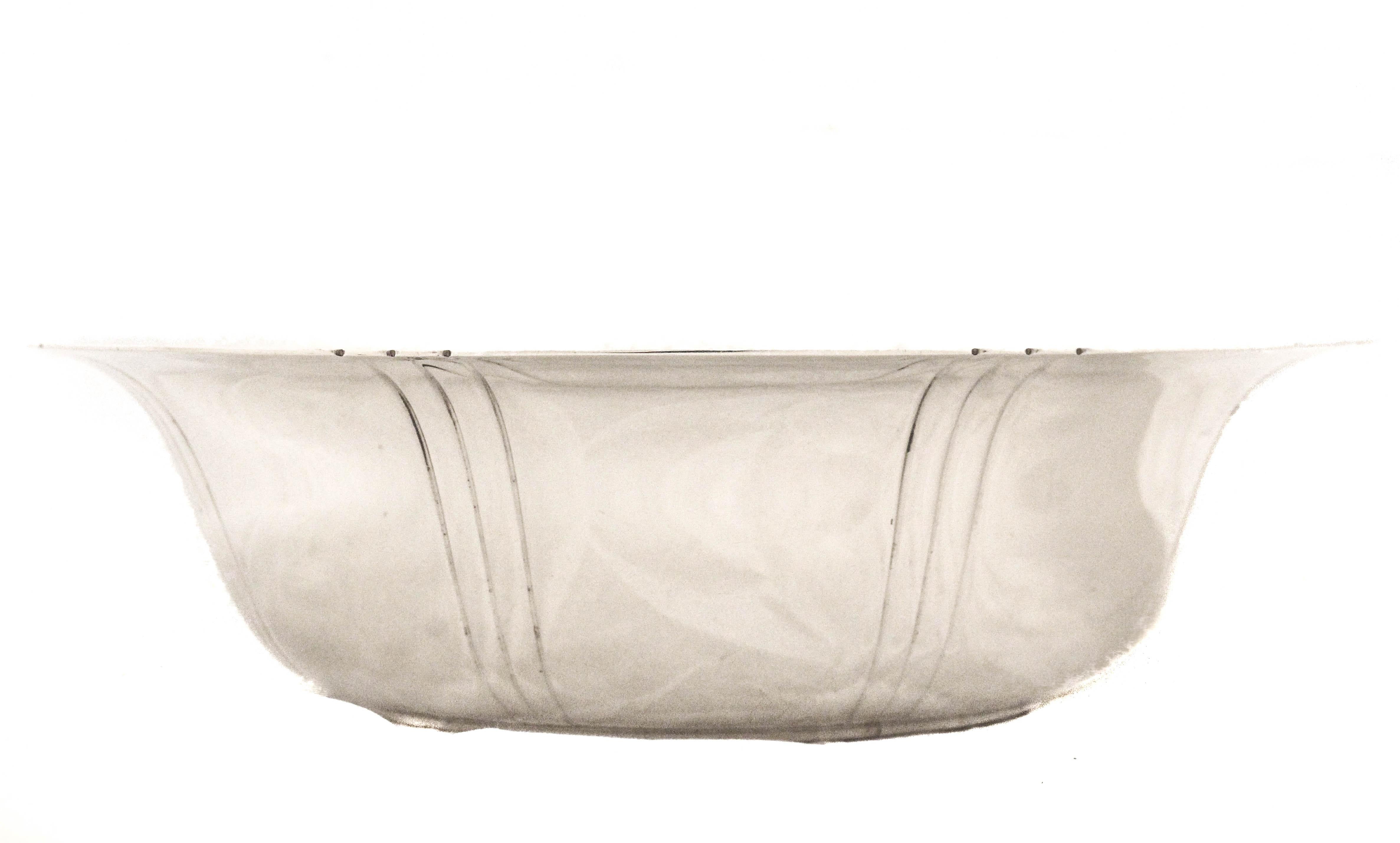 An elegant sterling silver bowl by Tiffany & Company, measuring 10 inches in diameter and 4 inches deep. The bowl features a flat, generously sized center engraved with a graceful hand-engraved script monogram, adding a personal and refined touch.