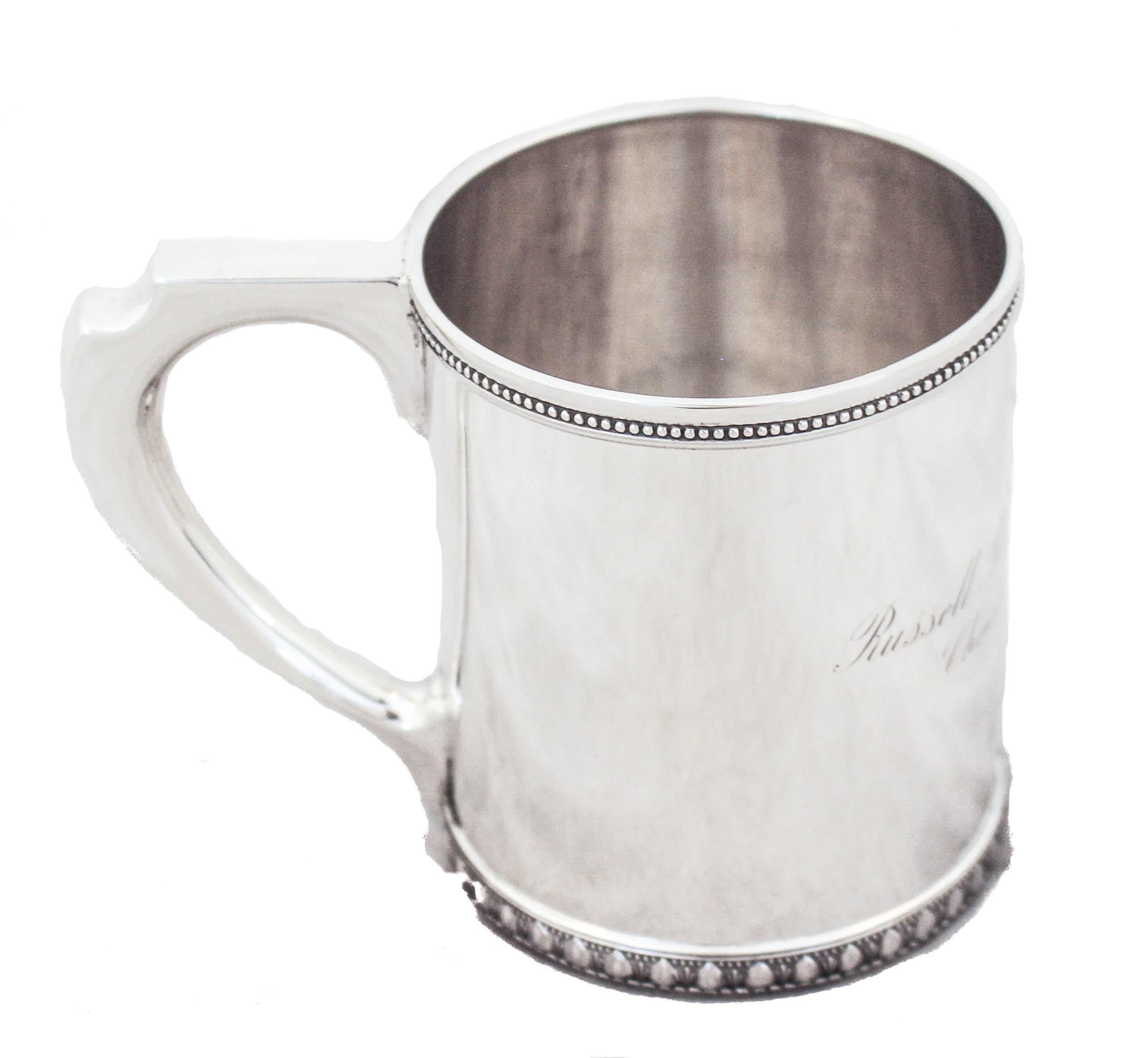 We are proud to offer you this sterling silver handled mug by the world renowned Tiffany & Company. It is 129 years old! Presented on Christmas 1894, it was made the year before. The hand engraved inscription reads:
”Russell Blaisdell