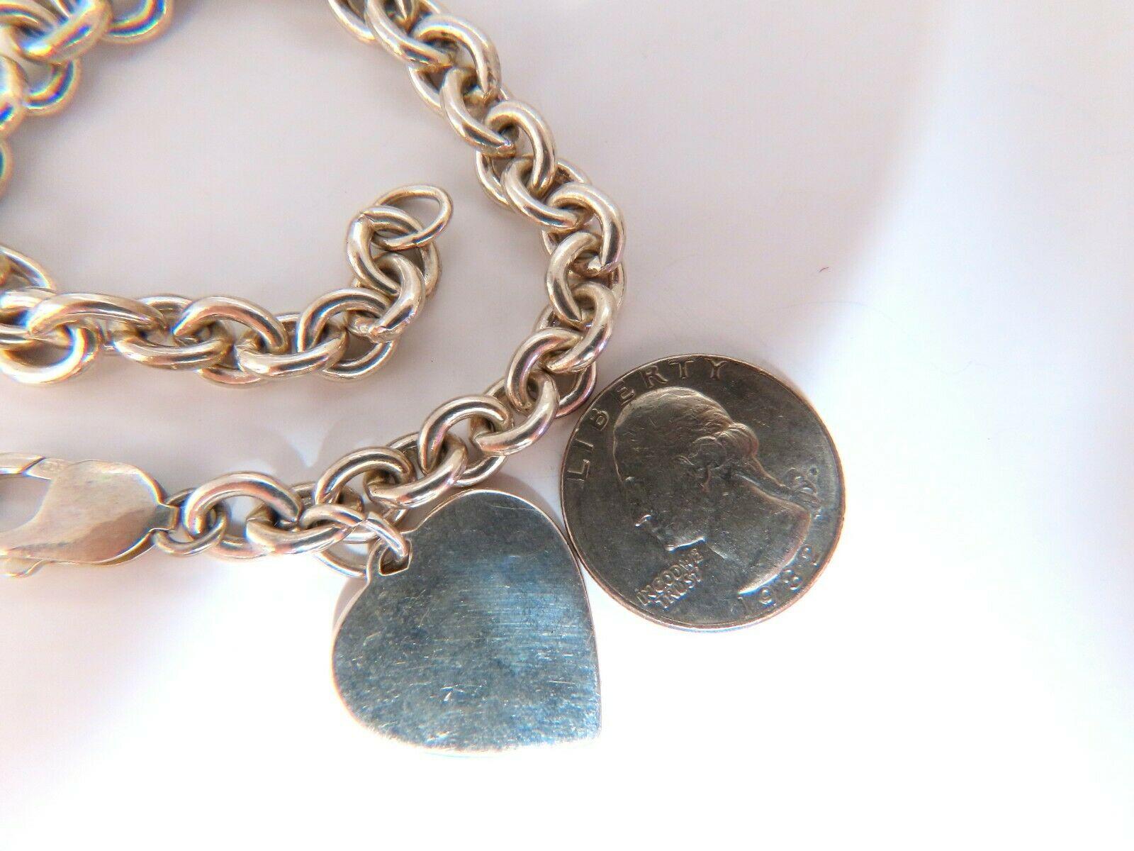 Bracelet de maillons en argent sterling en forme d'anneau et de cœur

8 pouces

Coeur : .8 x 1inch

liens de 0,33 pouce

Fermoir confortable en forme de homard

Argent sterling 34,9 g

Envoi gratuit et assuré du jour au lendemain. Tous les articles