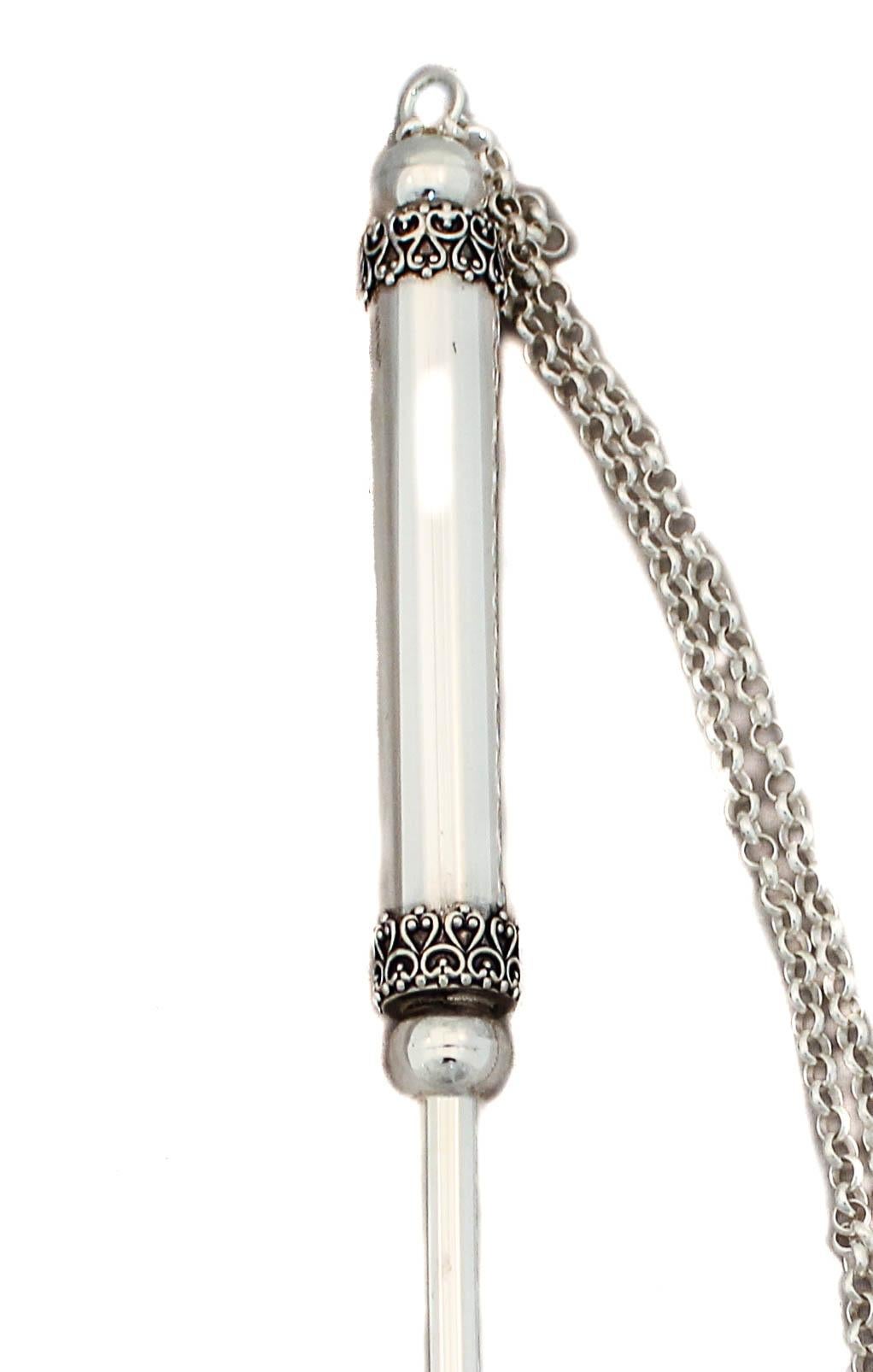 This sterling silver Torah pointer (Yad) from Israel has filigree work around the two ends of the handle and a sterling silver chain on the end to hang on the Torah. The tip has an index finger pointing, making it easier for the reader to follow