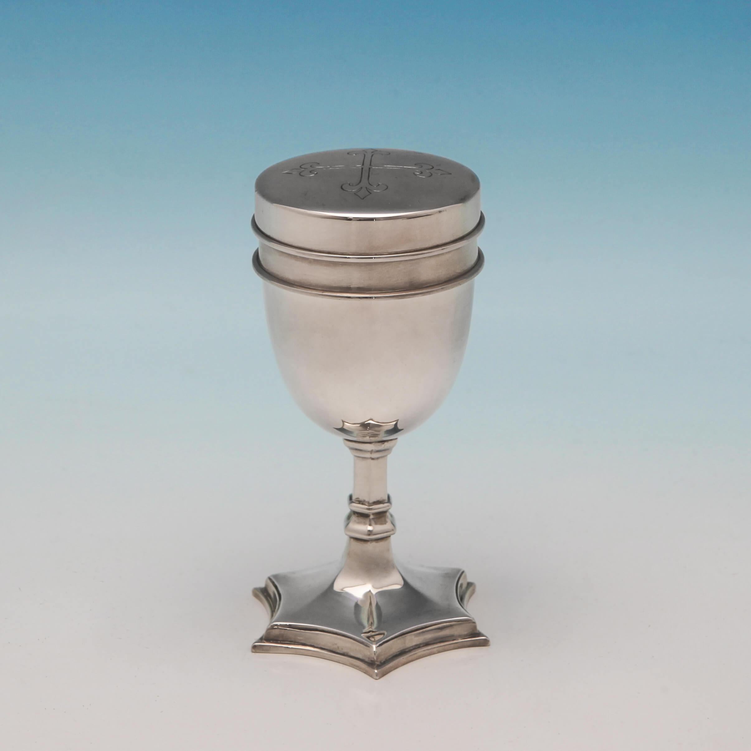 Hallmarked in London in 1929 by J. Wippell & Co. Ltd. This handsome, George V, sterling silver travelling communion set, comprises a chalice, and fitted pyx, in its original box. The chalice measures 3