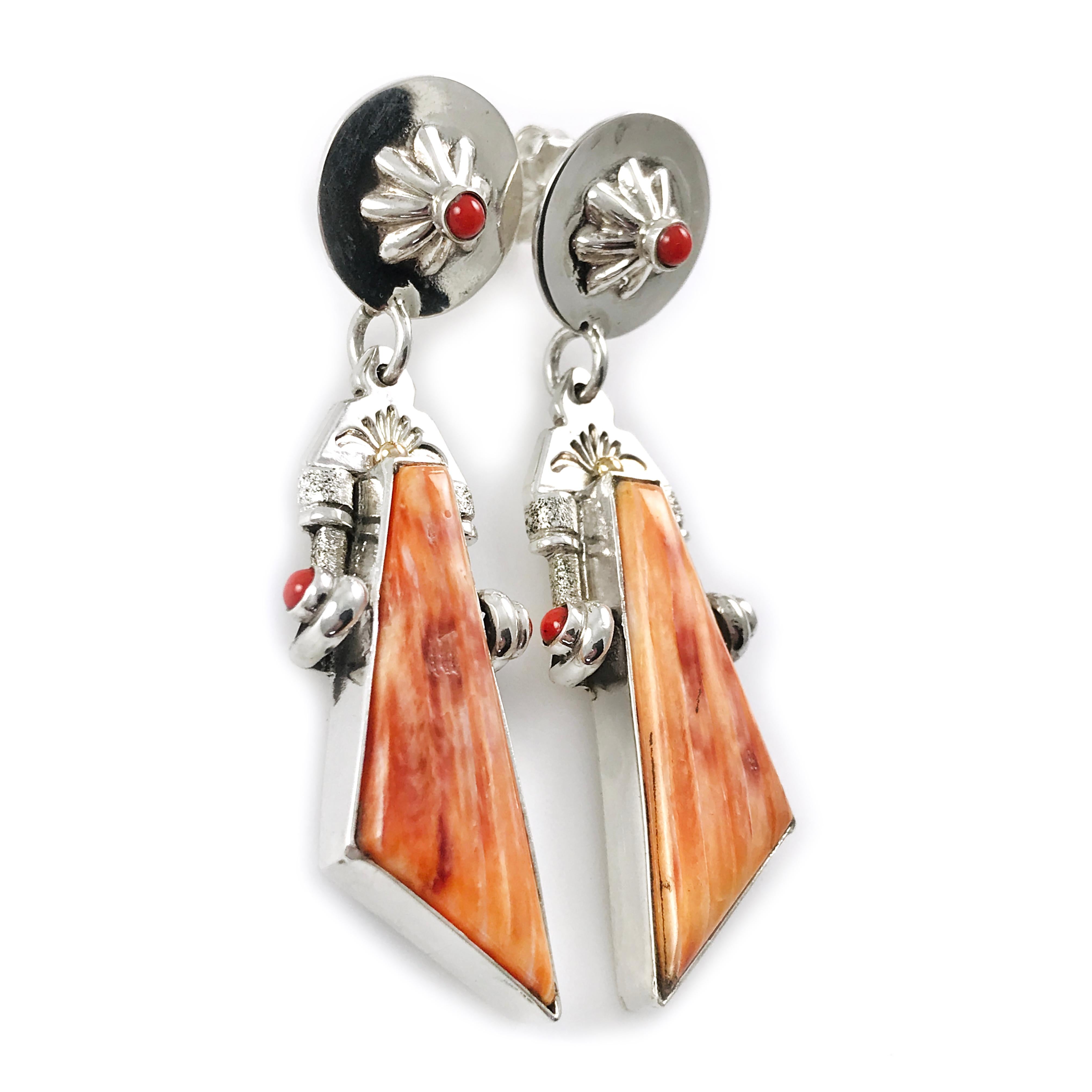 Handcrafted from Sterling Silver by jewelry maker, Ray Winner. These unique earrings feature an asymmetrical triangle-shaped spiny oyster cabochon and Mediterranean Coral round cabochons. Three Mediterranean Coral round cabochons are bezel-set in