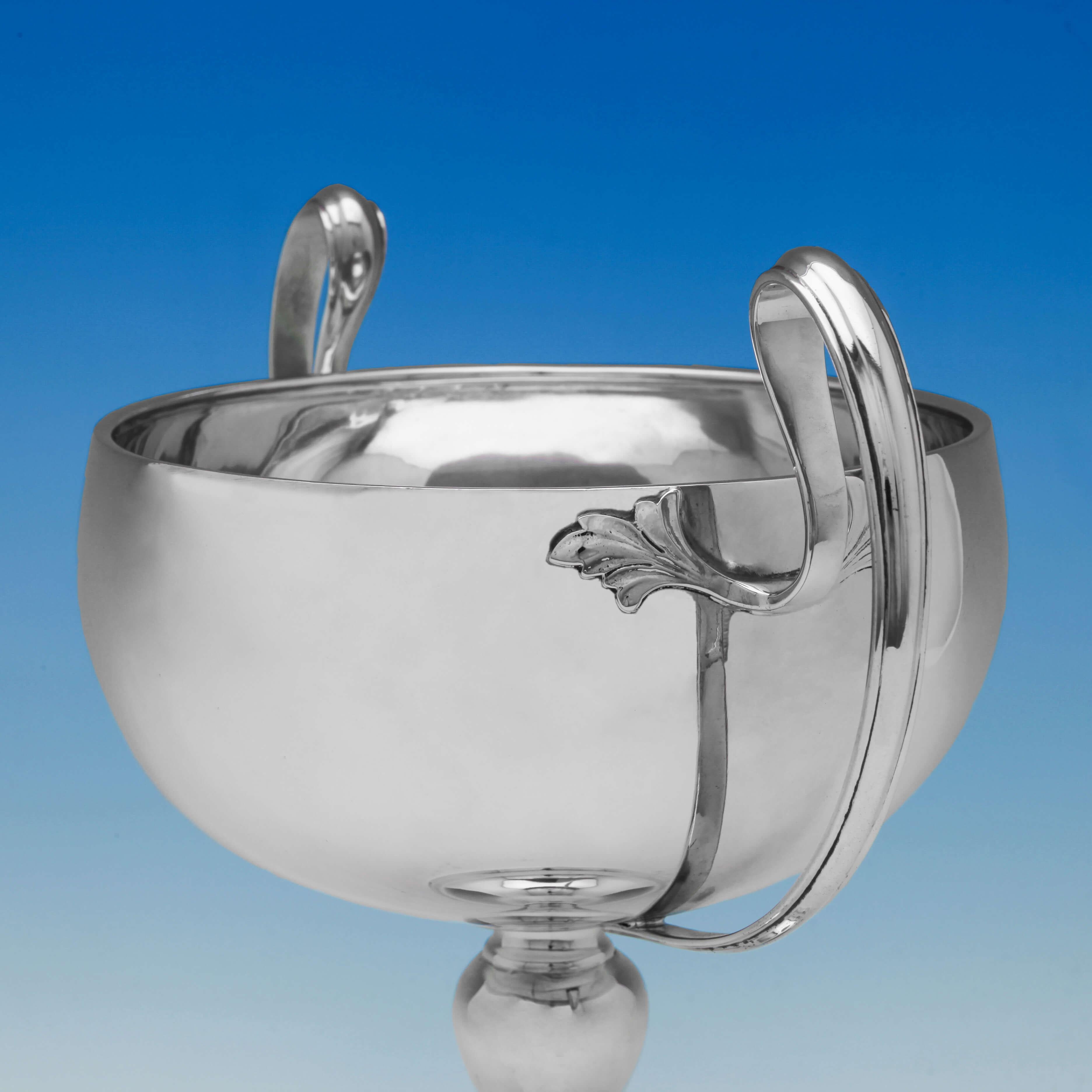 Hallmarked in London, 1926 by H. Phillips, this attractive, Art Nouveau, Sterling Silver Trophy, has a sleek and elegant style, with a plain body and loop handles. The cup measures 11