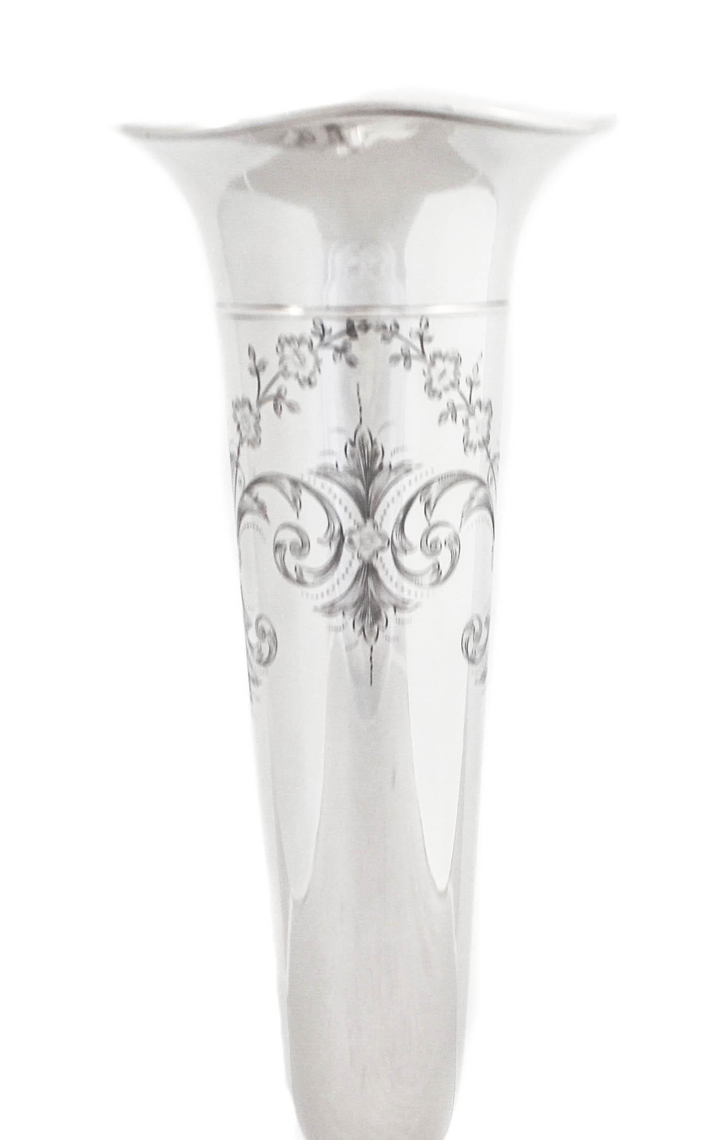 We are thrilled to offer you this sterling silver trumpet vase by George Henckel & Company of New York.  It has a fluted rim and a tapered body. There is an etched design towards the top of flowers and leaves.  The base is not weighted.  A great