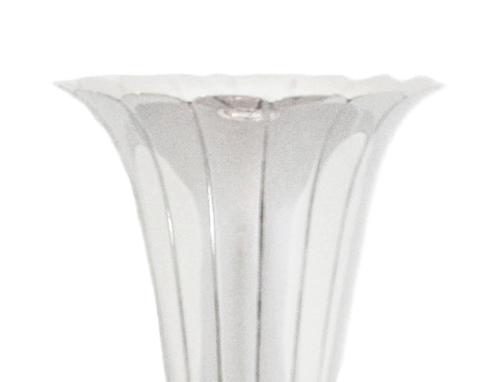 We are delighted to offer this sterling silver trumpet vase by the Watson Silver Company.  It is a mix between Art Deco and Mid-Century.  Notice the scalloped rim and the way it flares out giving the flowers more room to open.  It has a tapered