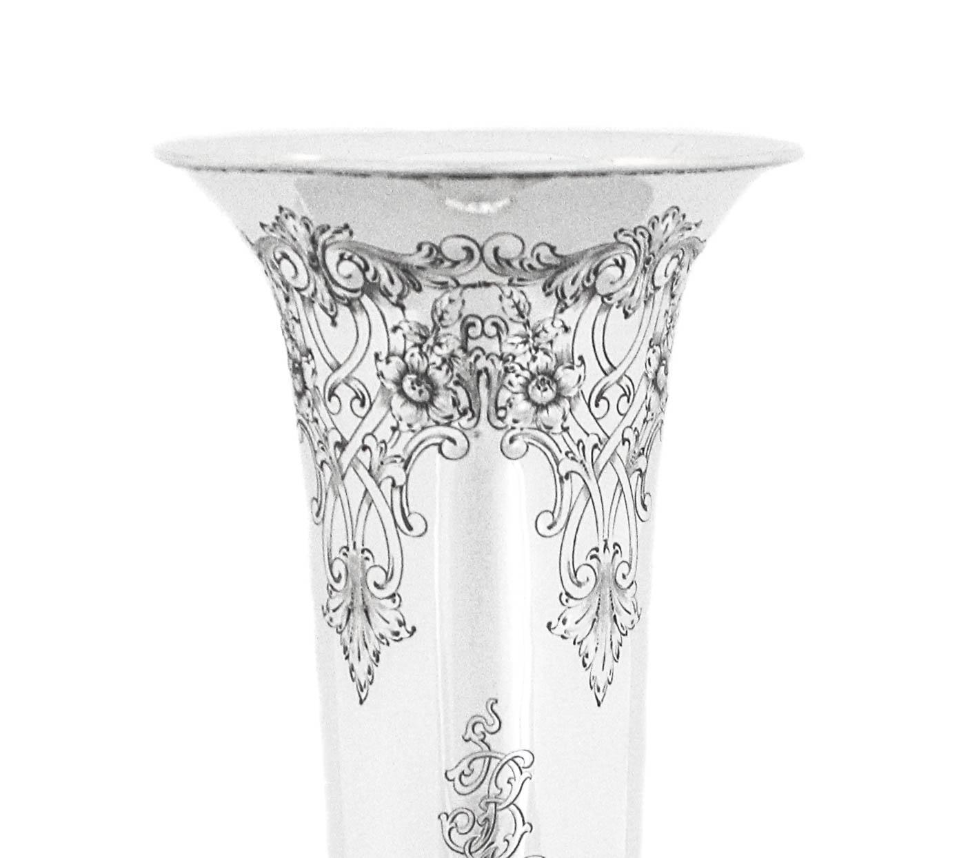 We are delighted to offer you this sterling silver trumpet vase manufactured by the Baltimore Silver Company.  It is lovely old-world chasing around both the base and top.  All the work is crisp and in mint condition, none has faded or been polished