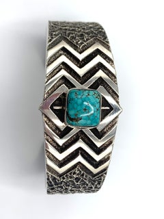 Sterling Silver Tufa Cast Cuff with Number 8 Turquoise by Kevin Yazzie