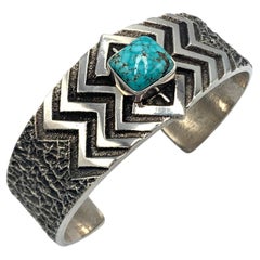 Sterling Silver Tufa Cast Cuff with Number 8 Turquoise by Kevin Yazzie