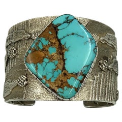 Sterling Silver tufa cast cuff with turquoise stone by Philander Begay