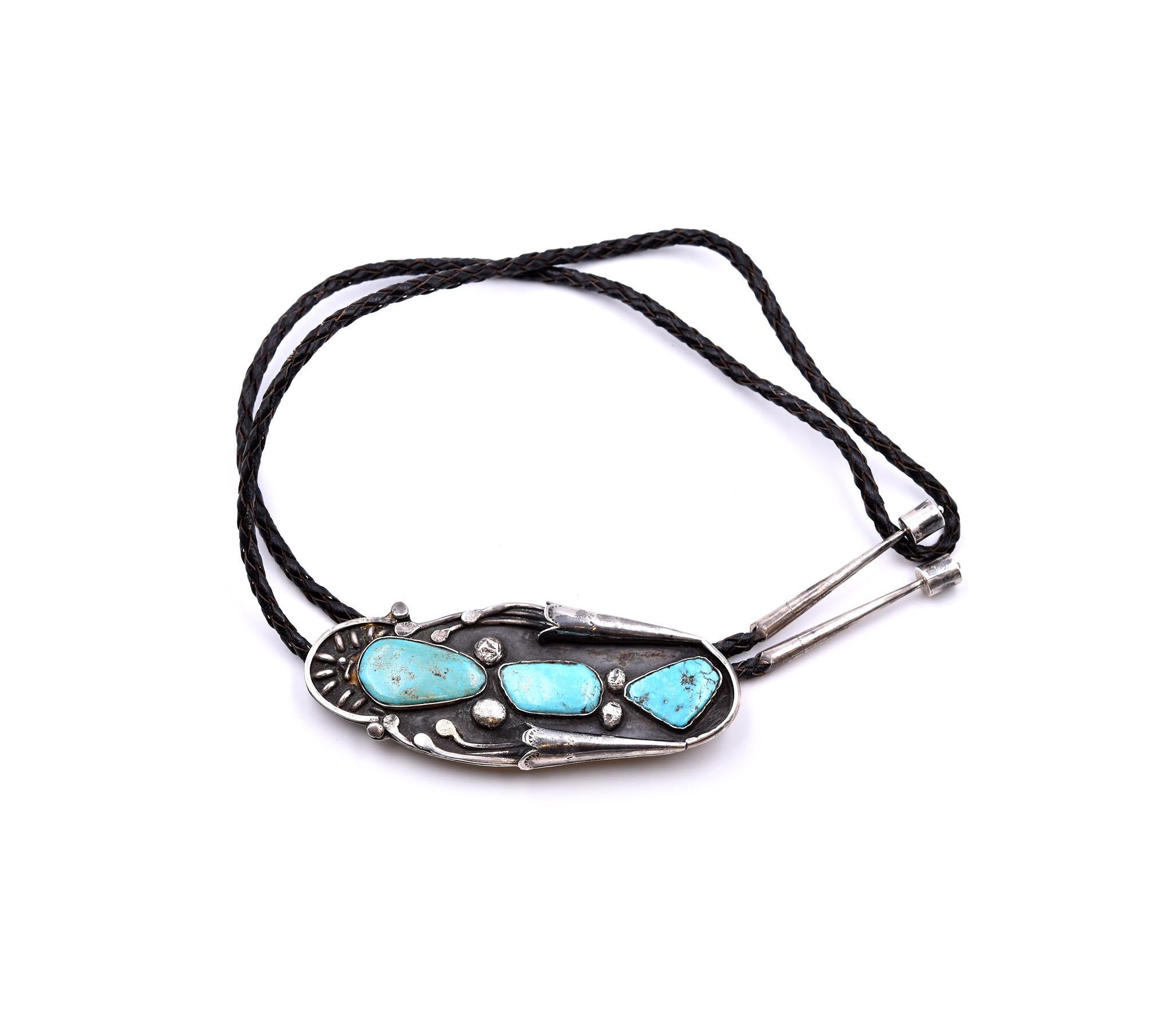 Designer: custom design and hallmarked “Bennett”
Material: sterling silver
Gemstones: turquoise
Dimensions: tie measures 19 inches in length and pendant measures 110mm x 45mm
Weight: 80.42 grams
