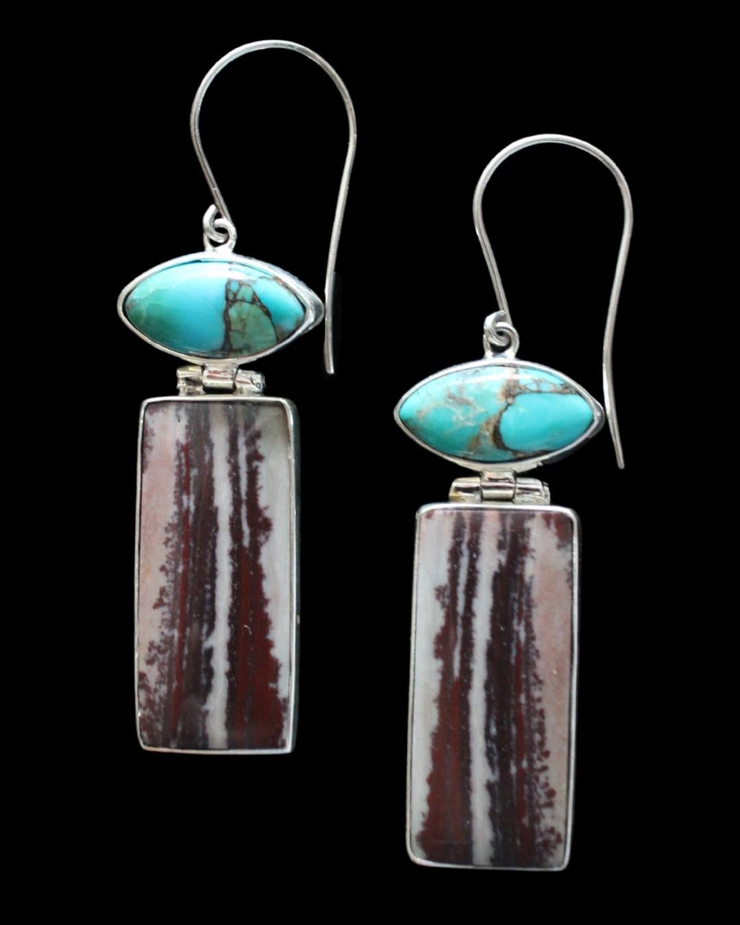 The sterling silver setting has a hinge that connects the marquis cut turquoise stone with the long, rectangular dendritic jasper cabochon. We collaborate with a master silversmith in Java, the heart of Indonesia's silver industry, to create this