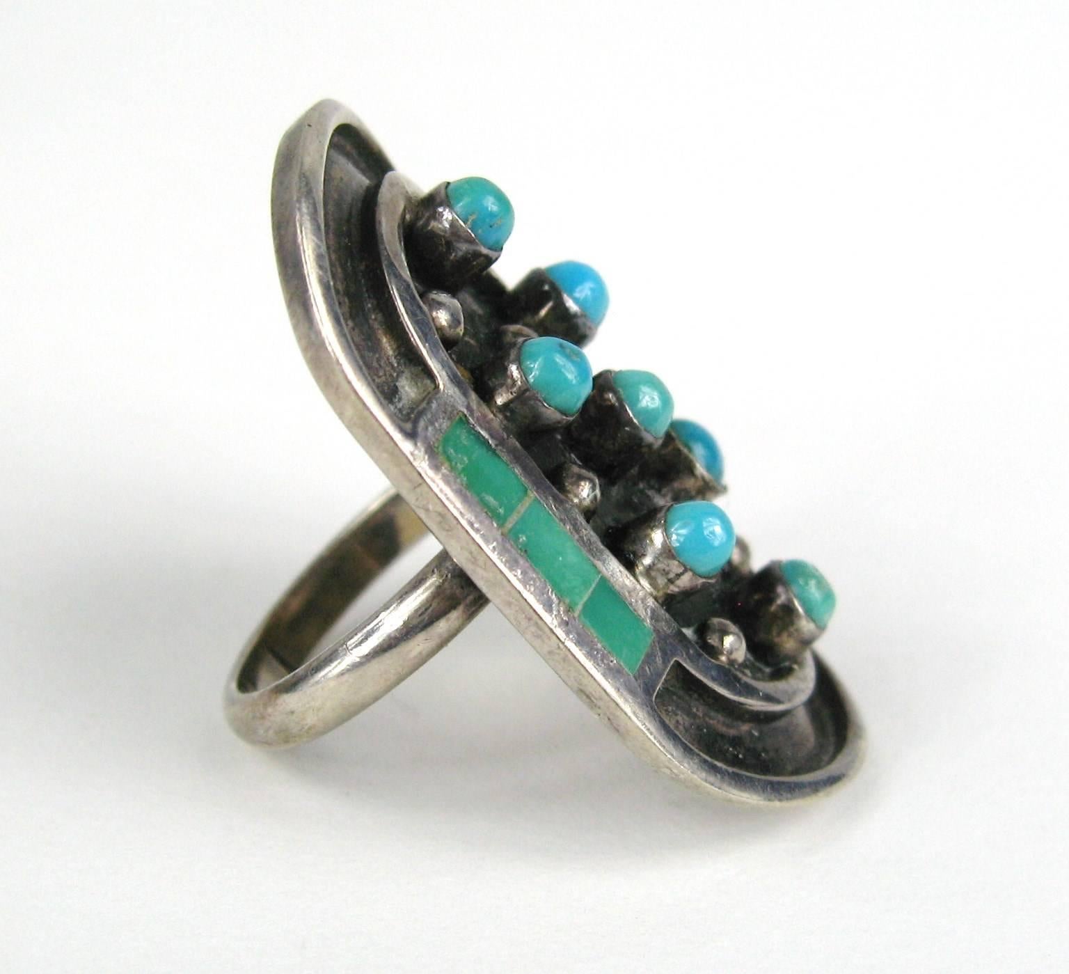 Sterling Silver Pawn Ring Turquoise Inlay and Bezel stones. Signed by Jobeth Mayes with a Stork Hallmark. Mayes Maize right of Stork. Featuring 7 Turquoise Nuggets. Each framed in Individual Bezels. 6 Hand Cut and Polished Turquoise Inlay. Measuring