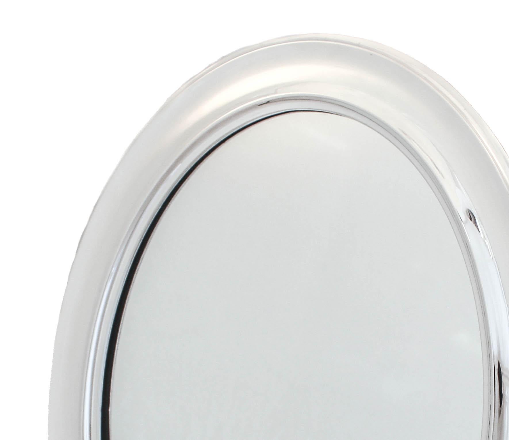 A magnificent example of sterling silver Art Deco design. This vanity mirror was manufactured by I. N. Deitsch of New York in 1920. Think Chrysler Building, F. Scott Fitzgerald and the great mansions of Long Island; it was the roaring twenties and