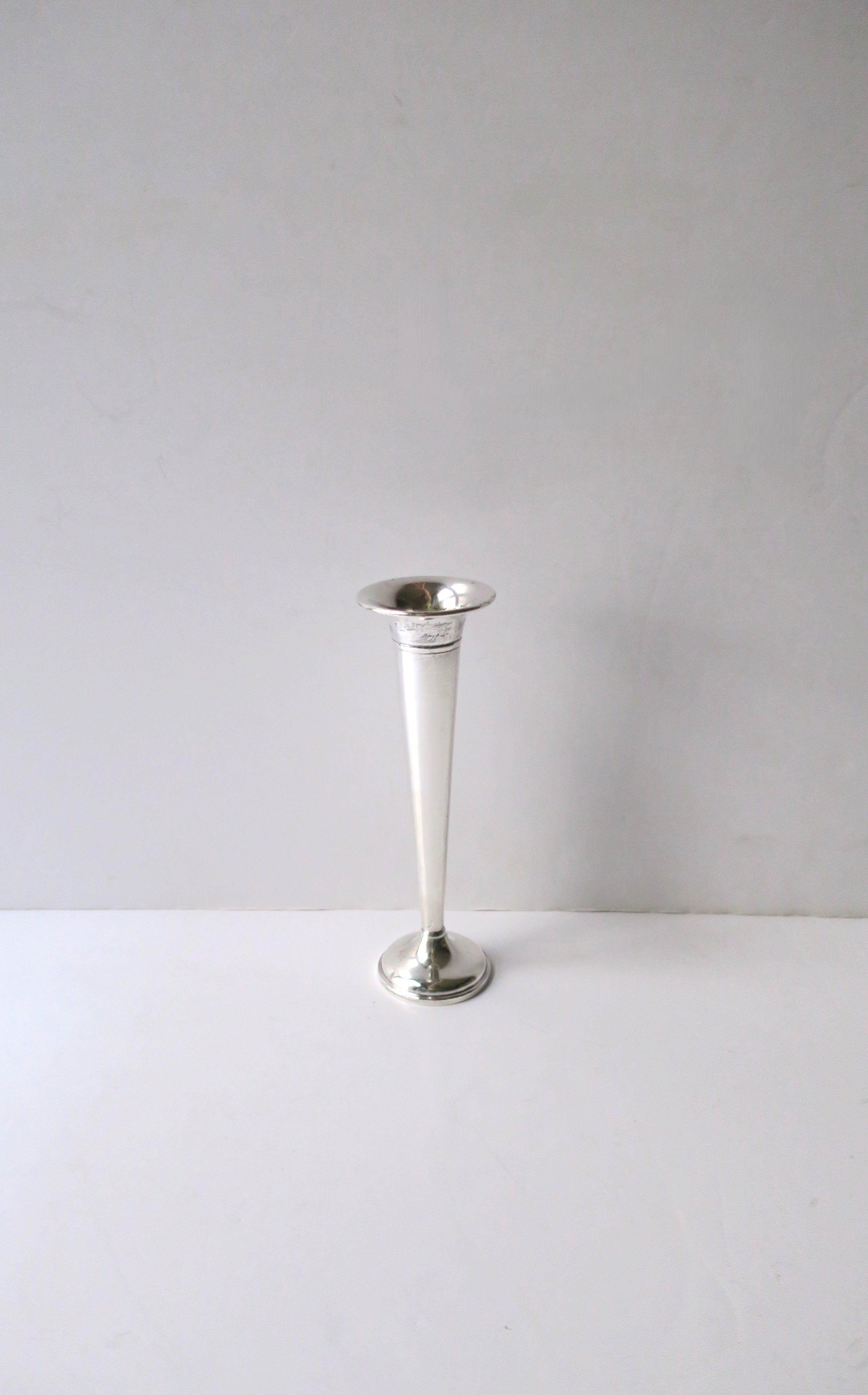 A sterling silver trumpet bud vase by Preisner, circa early-20th century. Beautiful as a standalone piece or with flower. Add to a table, shelf, vanity area, etc. And a great piece to start or add to a sterling silver collection. With makers' mark
