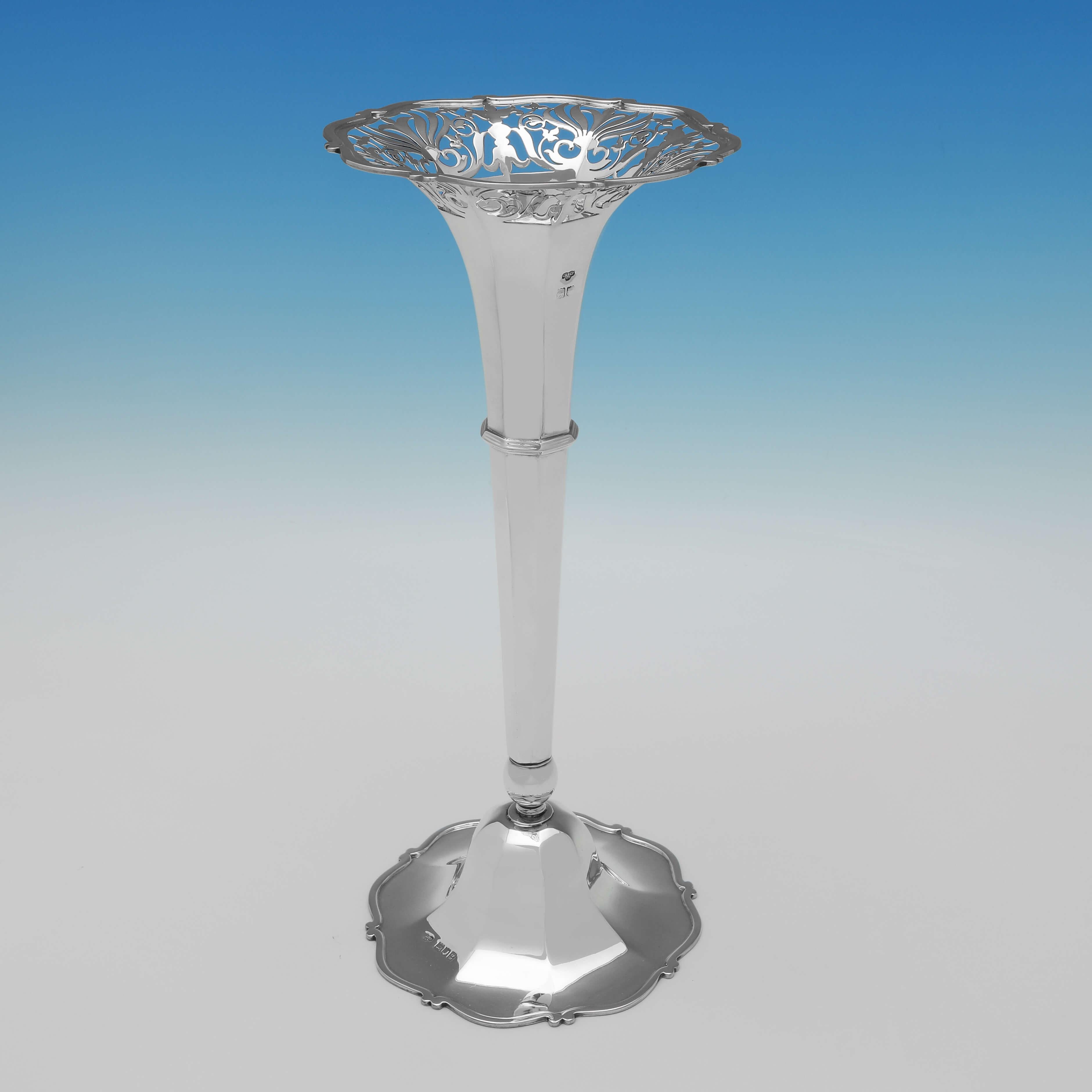 Hallmarked in London in 1902 by Goldsmiths & Silversmiths Co., this very attractive, Edwardian, Antique Sterling Silver Vase, has octagonal panelling, a shaped border to the foot and rim, and a pierced top. The vase measures 11.75