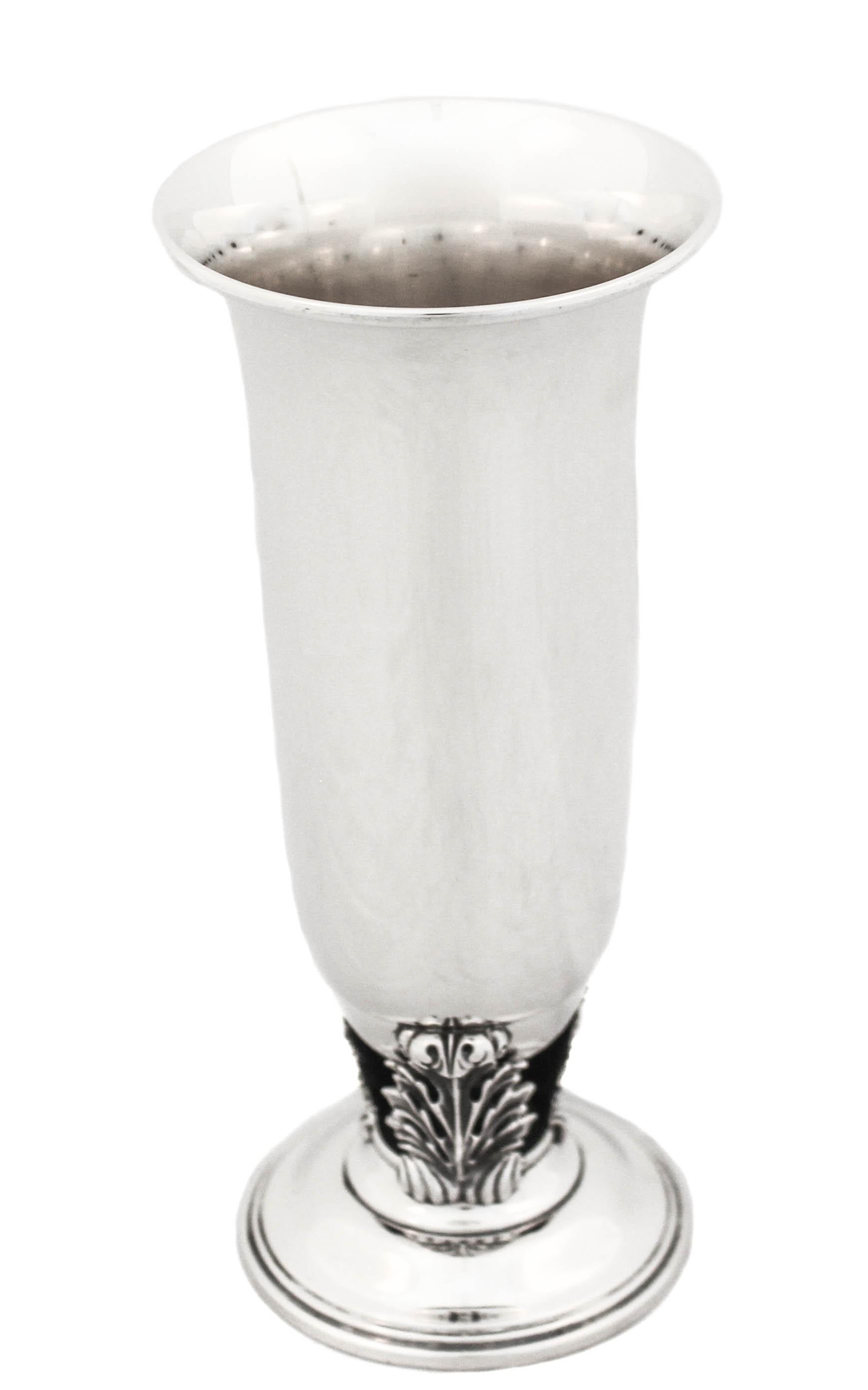Being offered is a sterling silver vase by the Quaker Silver Company. It has a Mid-Century modern style; sleek with three leaves connecting the vase to the base (base is not weighted). The rim opens outwards allowing the flowers to spread and