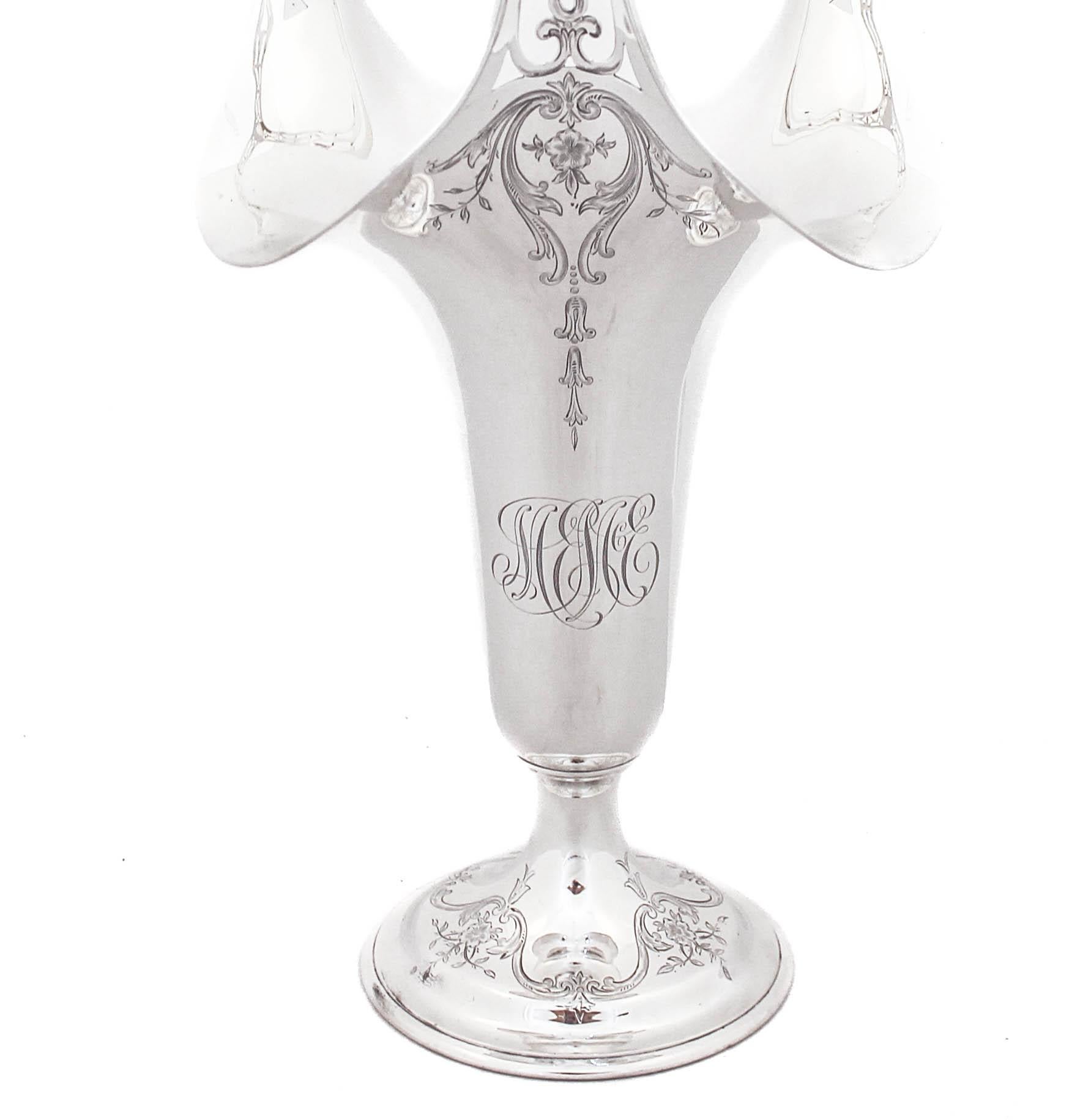 We are proudly offering a sterling silver vase by Whiting Manufacturer hallmarked 1920.  It has a fluted rim with a three-handle.  The three-handle is reticulated and has a dome-like shape.  The body of the vase is tapered and feminine with
