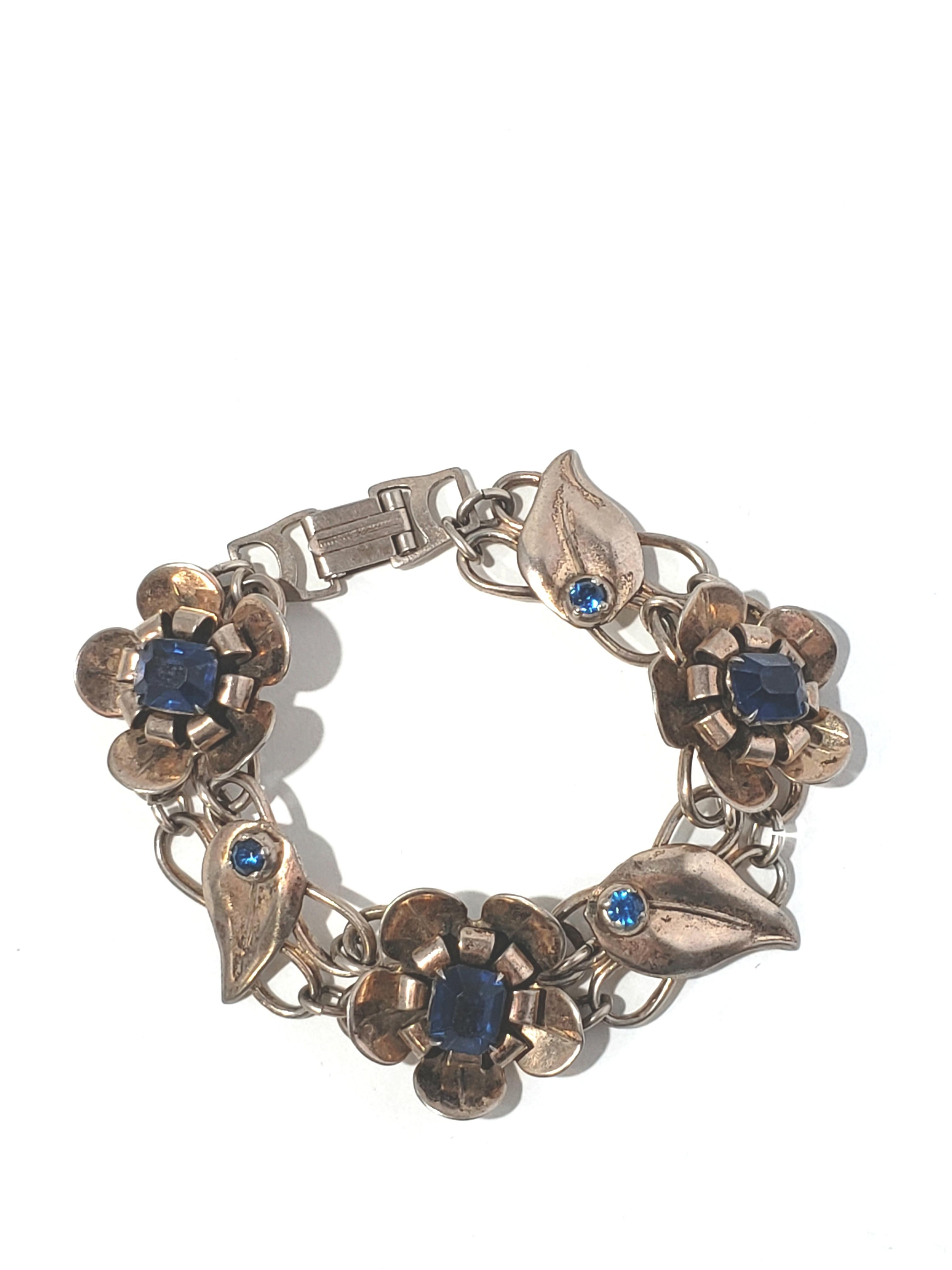 Vintage Sterling Silver Vermeil Flower Link Blue Stone Bracelet

This is a lovely Sterling Silver Vermeil Flower Link Bracelet with alternating blue stones.

Measurements: Bracelet measures 7 1/2 inches. Width is 7/8 inches.

Weight: 28.0 g / 18.0