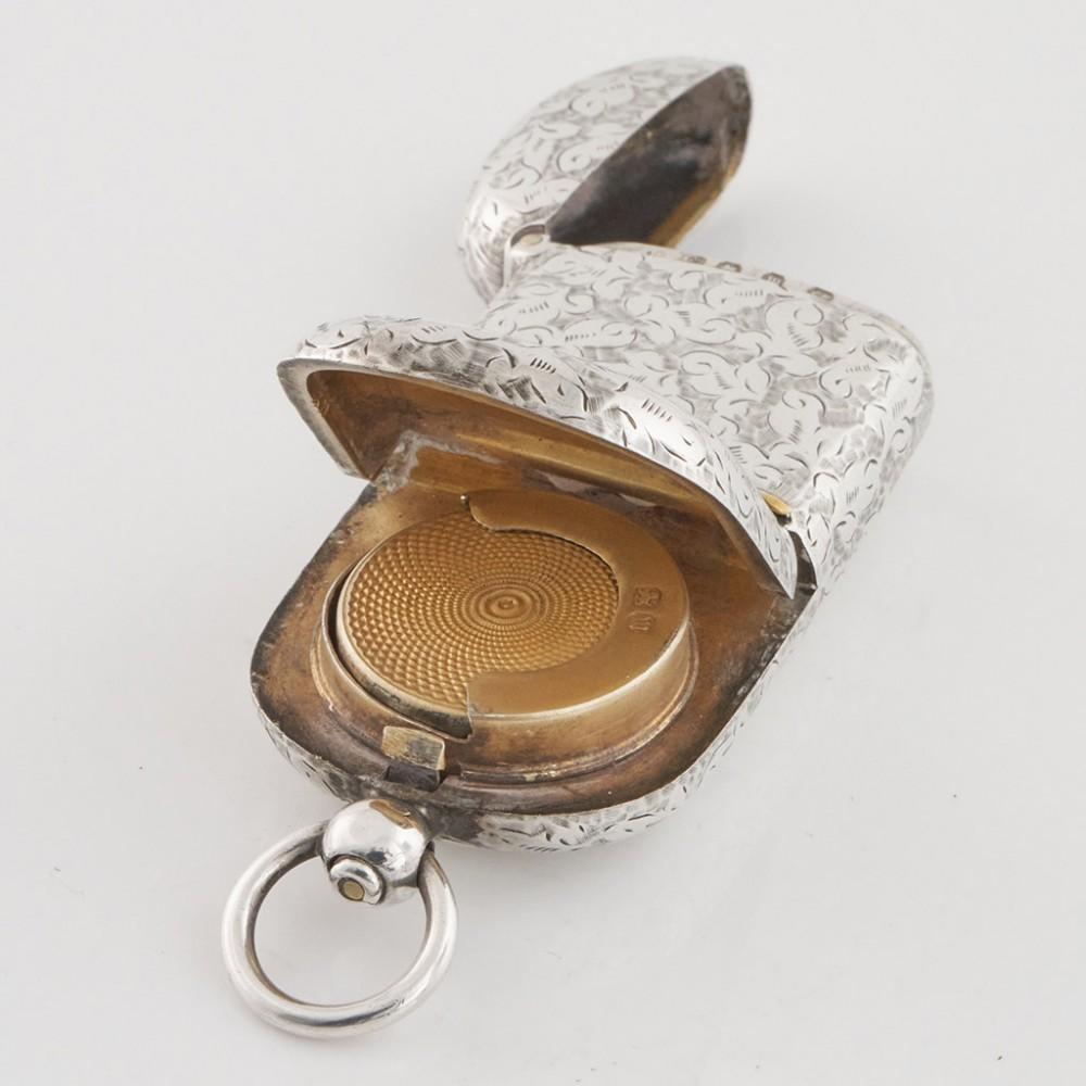 Heading : Sterling Silver Vesta Combination Sovereign Case
Date : Hallmarked in Birmingham 1886, makers mark partly runbbed
Period : Victoria
Origin : Birmingham England
Decoration : Hinnged cover on the vesta with match striker. The sovereign case