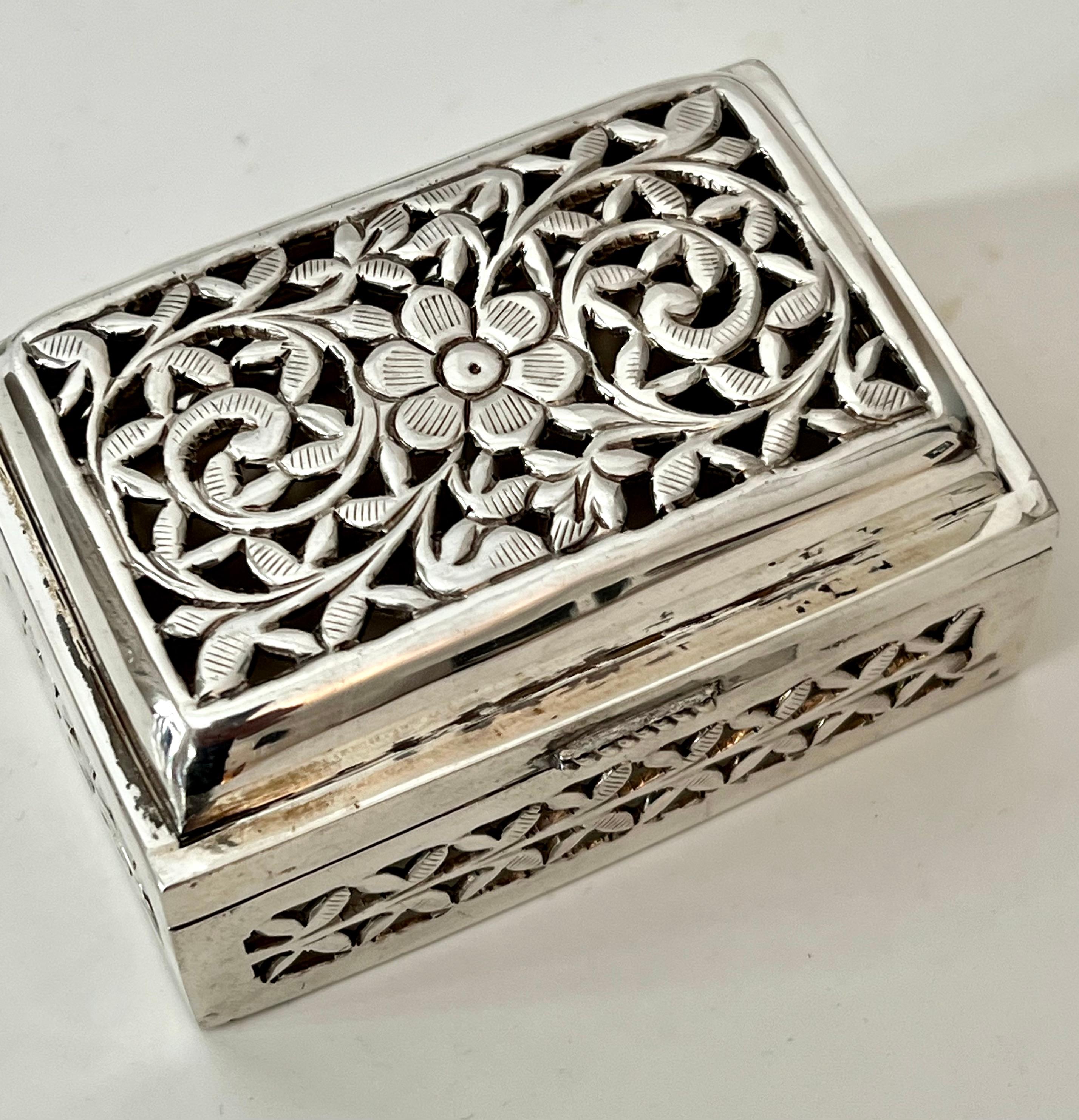 A hand crafted sterling box with cut-outs in the shape of botanicals of ivy, vines and flowers.  The box perhaps a vinaigrette, could now be used for herbs, fragrant florals, or 420. 

A compliment to any cocktail table, vanity, desk or work