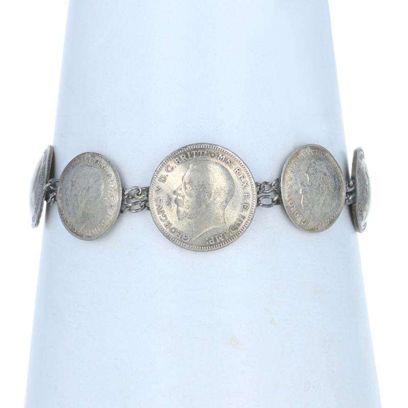Era: Vintage

Metal Content: 925 Sterling Silver (bracelet) & 50% Silver (coins)

Style: Chain Station 
Bracelet Chain Style: Double Curb
Fastening Type: Double Hook Clasp
Theme: British Currency, Coins

Measurements

Length: 6 3/4